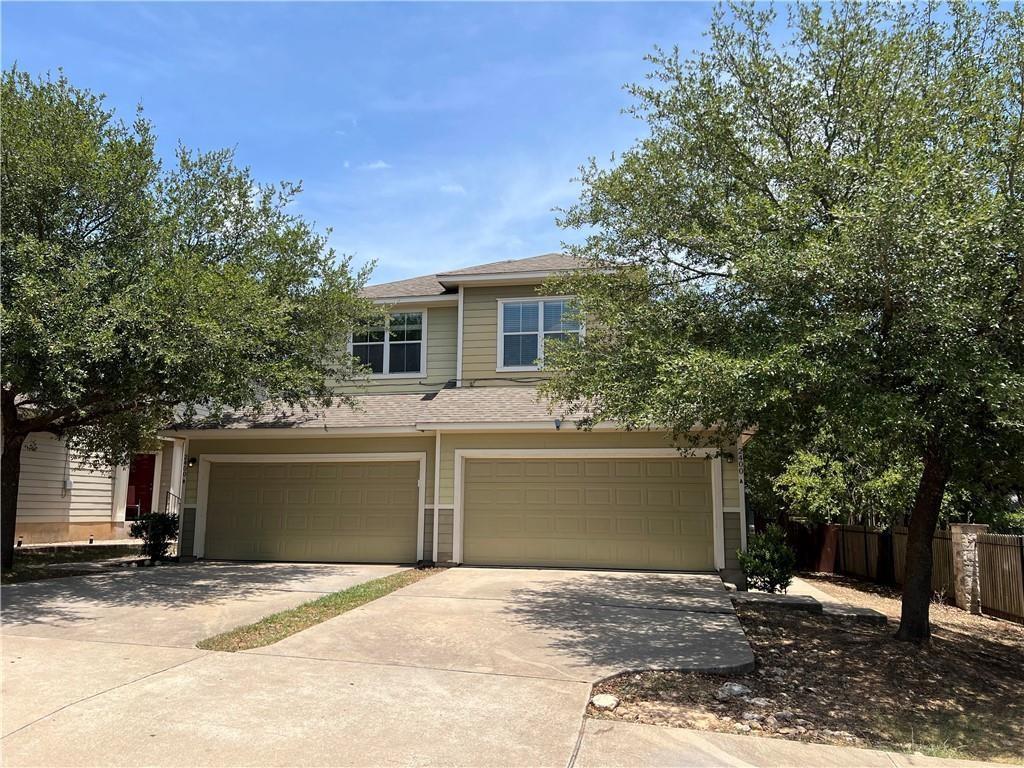 A welcoming facade with a dual garage entrance an