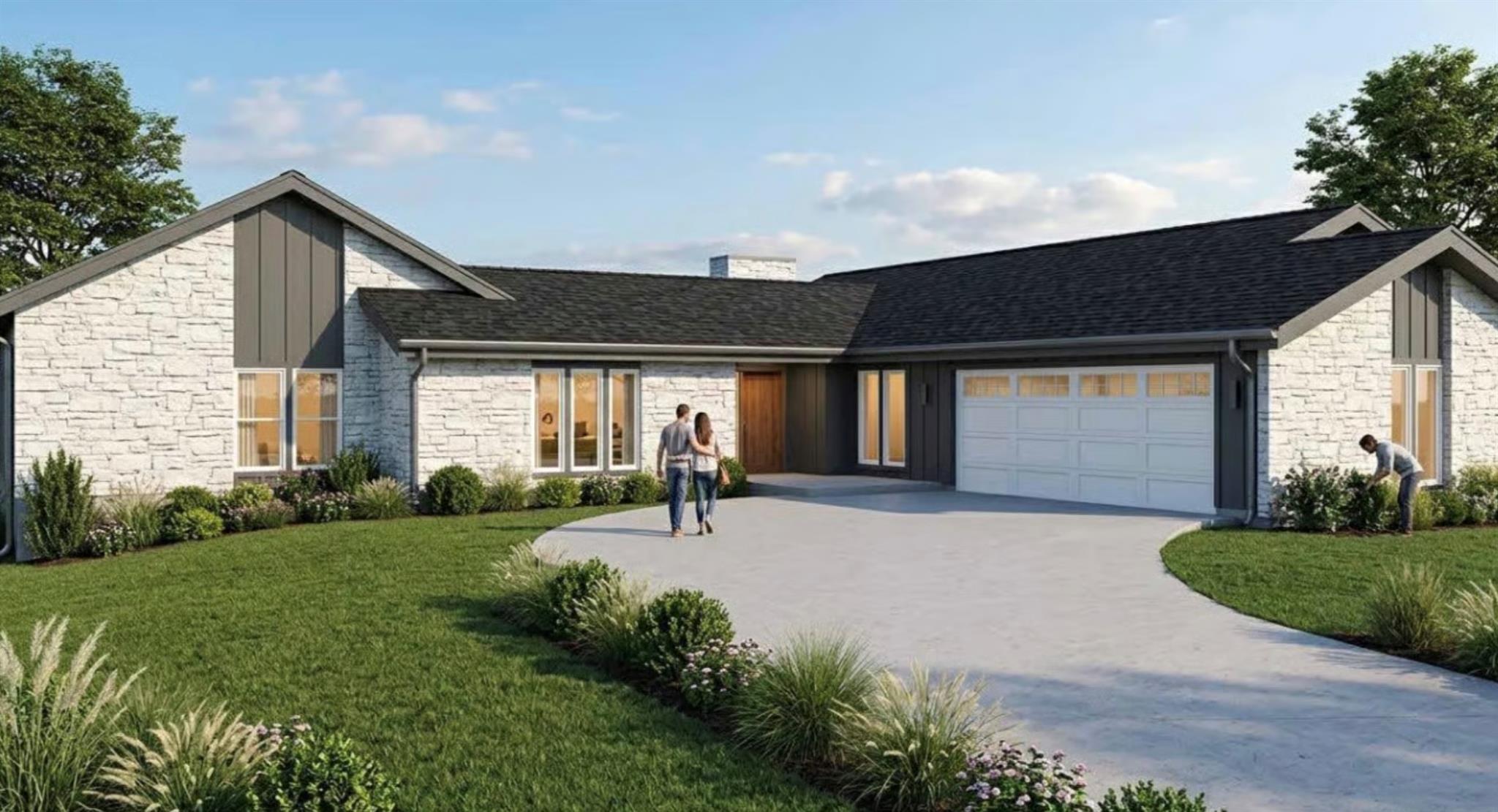 A graceful curved driveway introduces this distin