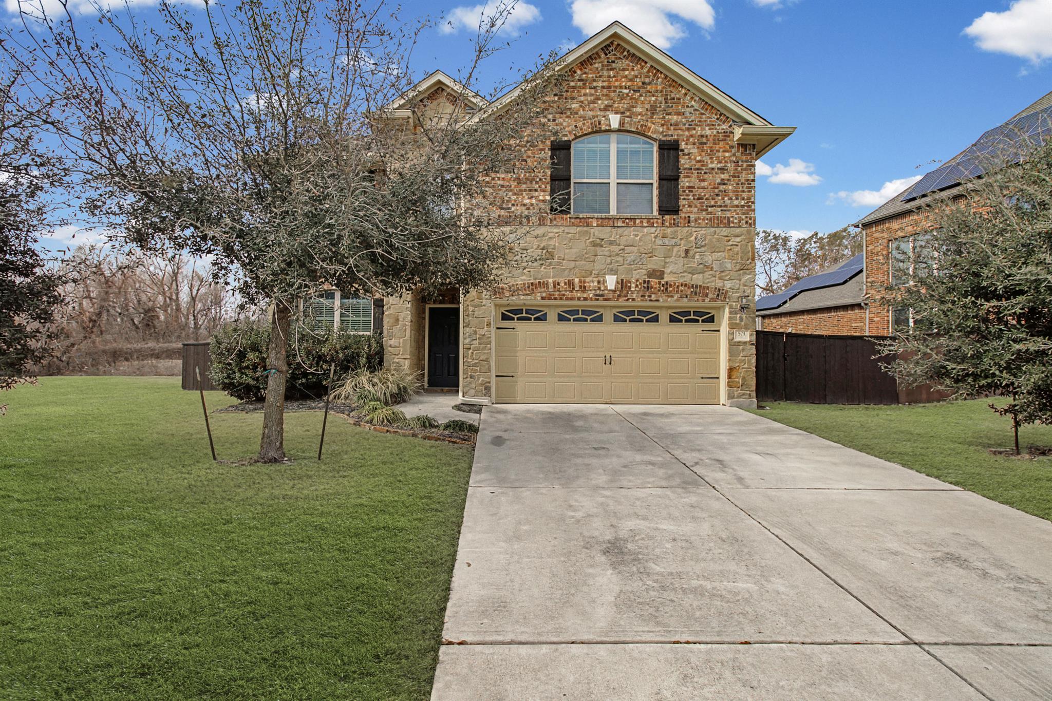A classic brick and stone facade welcomes you to 