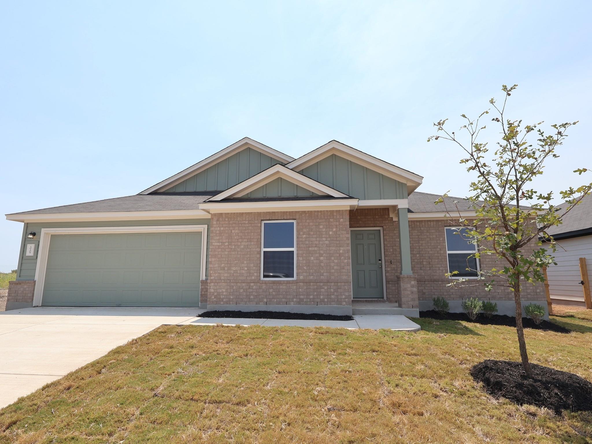 A classic brick exterior and gabled rooflines cre