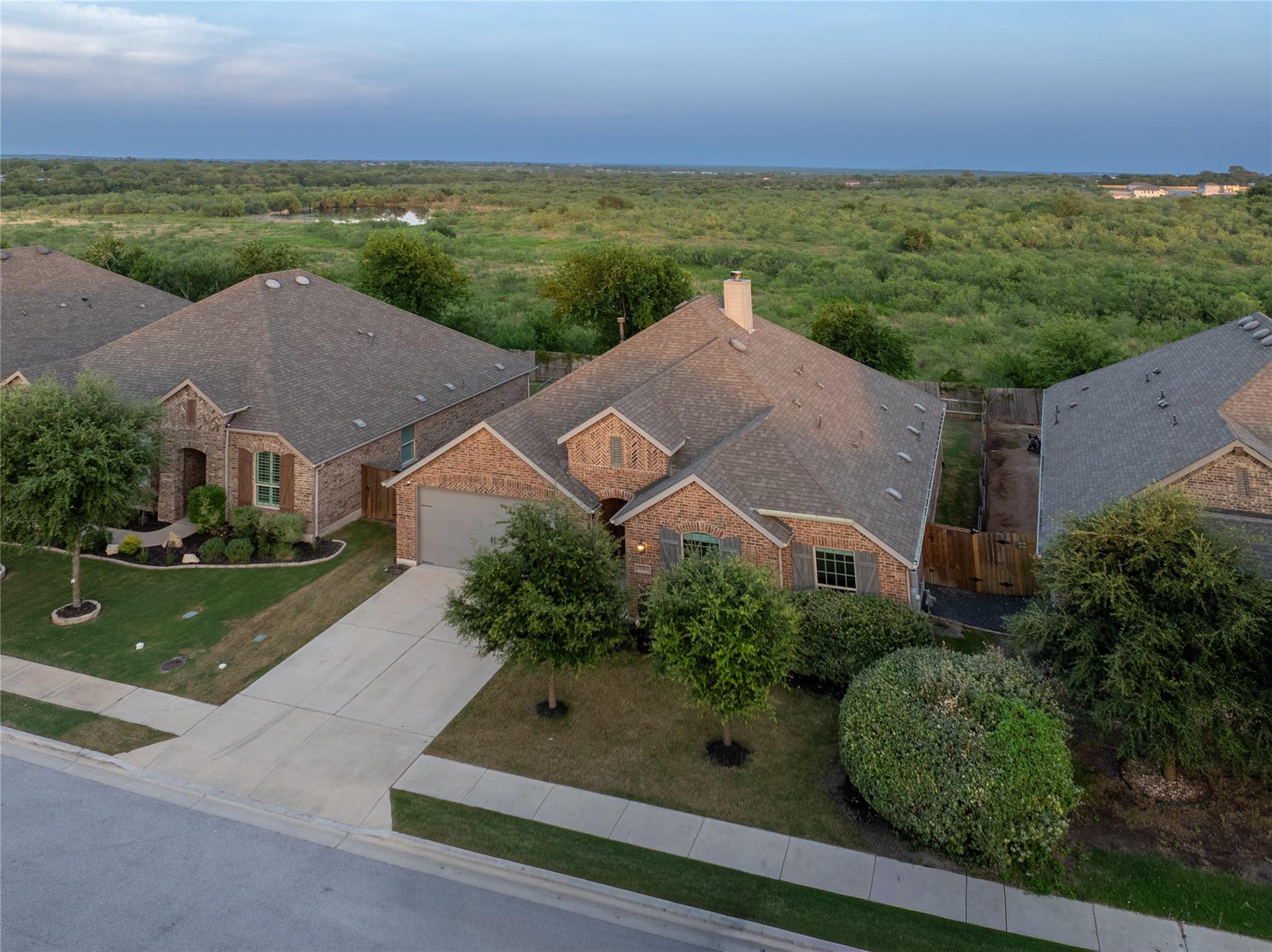An aerial perspective reveals a charming brick ho
