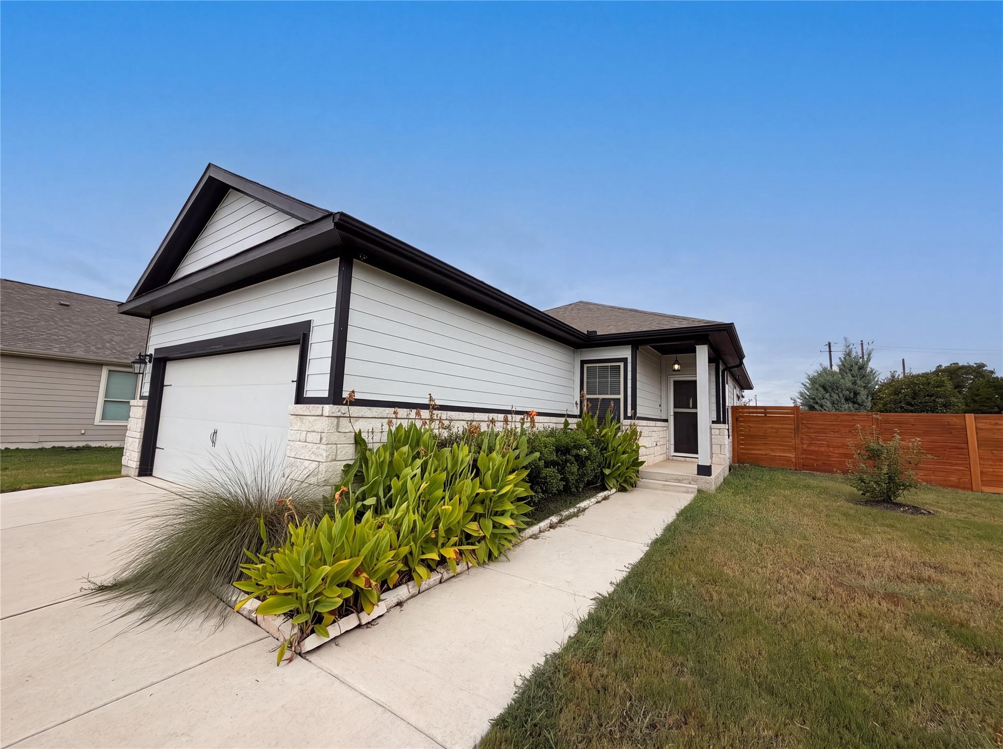 A well-maintained single-story home with a neat f