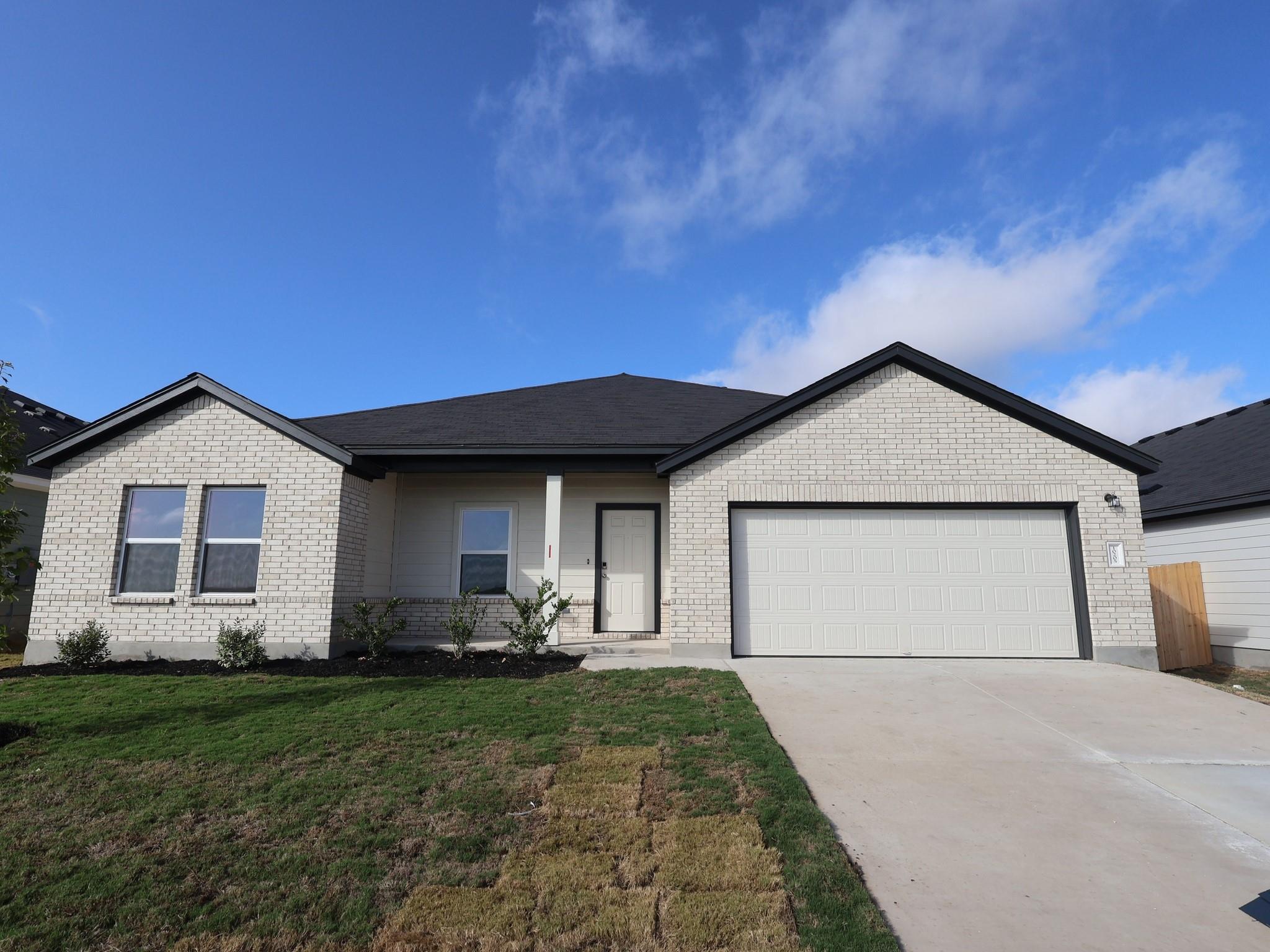 Clean lines and classic brick masonry define the 