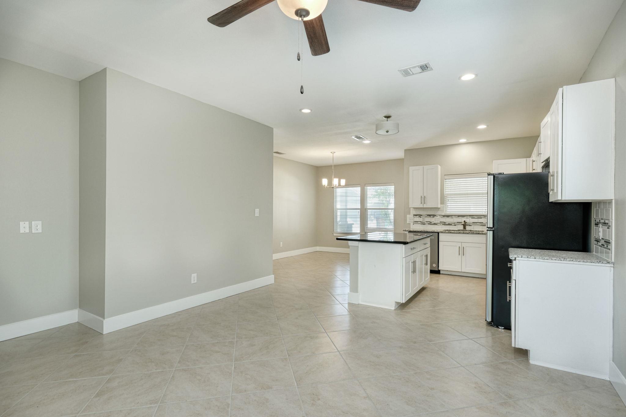 An open-concept living space integrates a well-ap