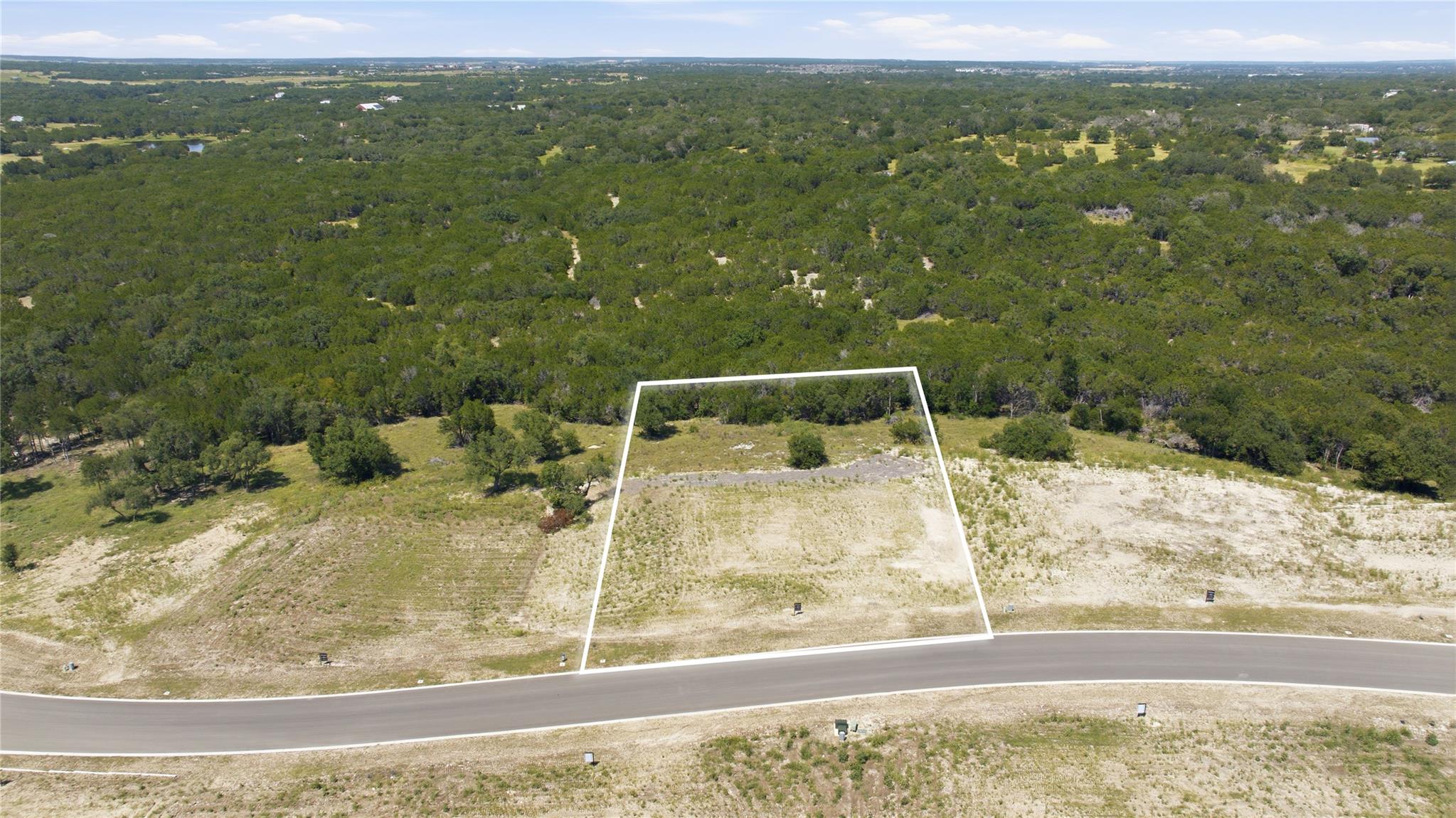 A spacious, naturally elevated lot awaits your cu