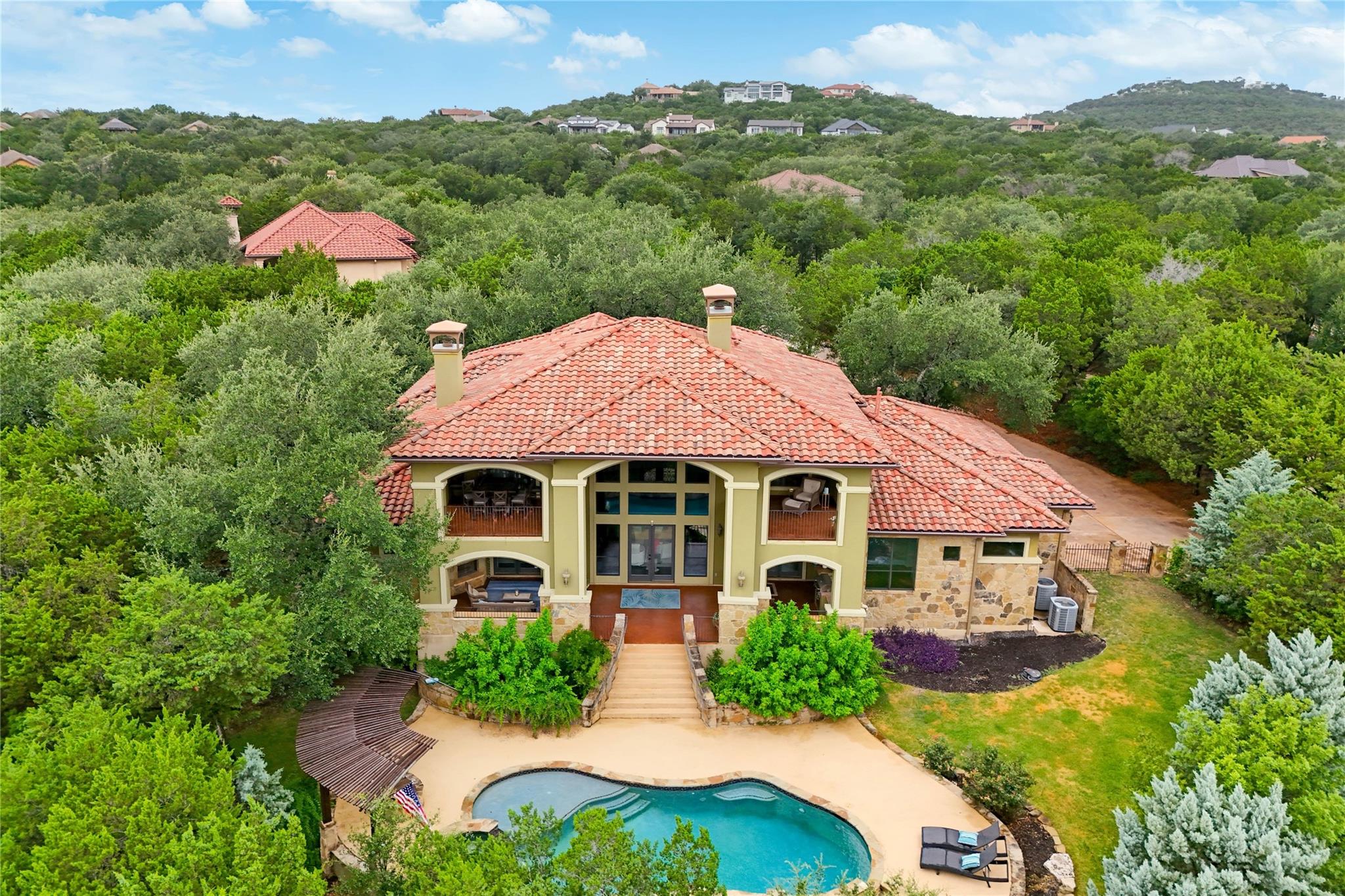 An aerial perspective reveals a majestic home wit