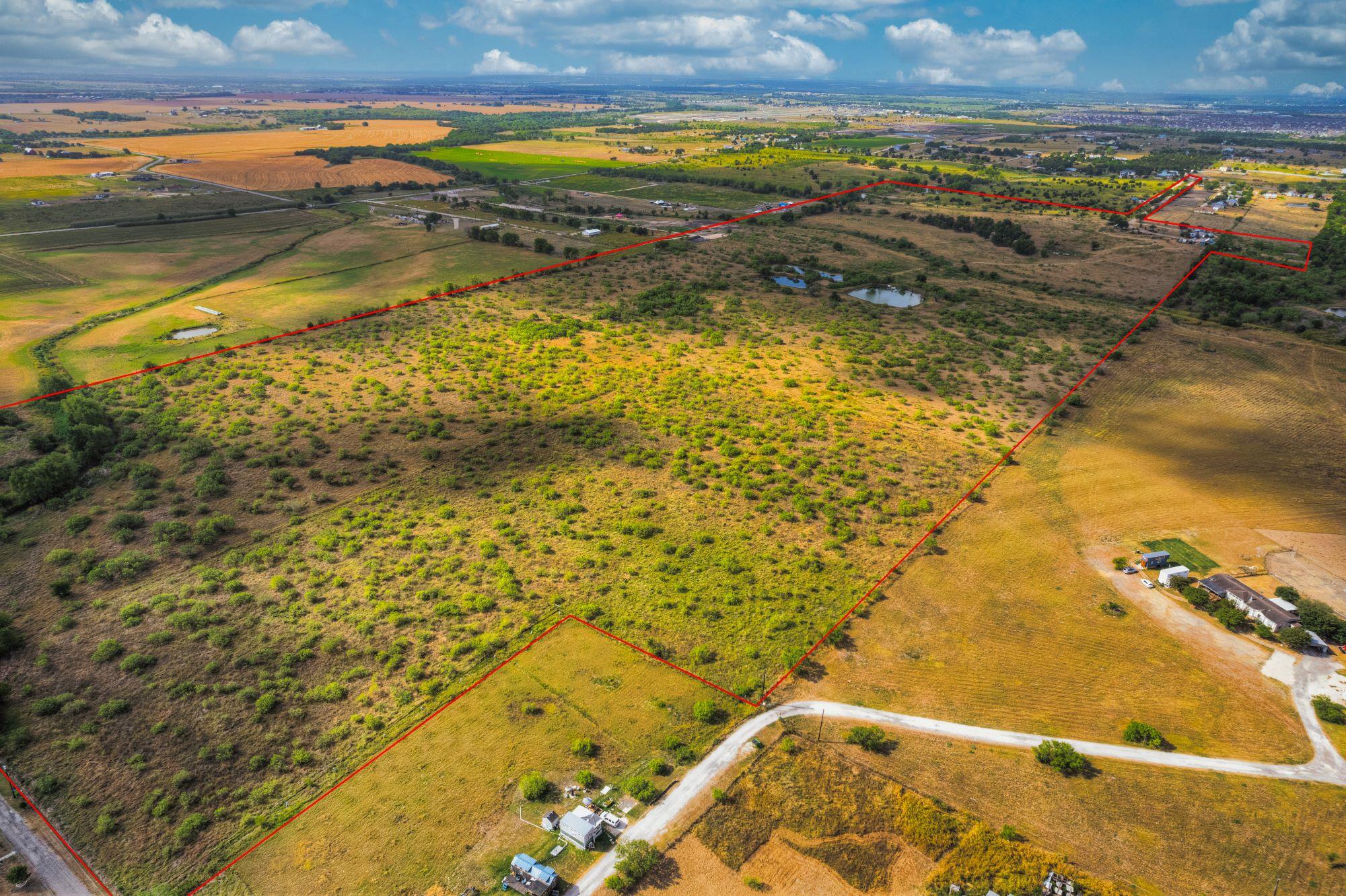 A vast, open expanse of rural landscape awaits, f