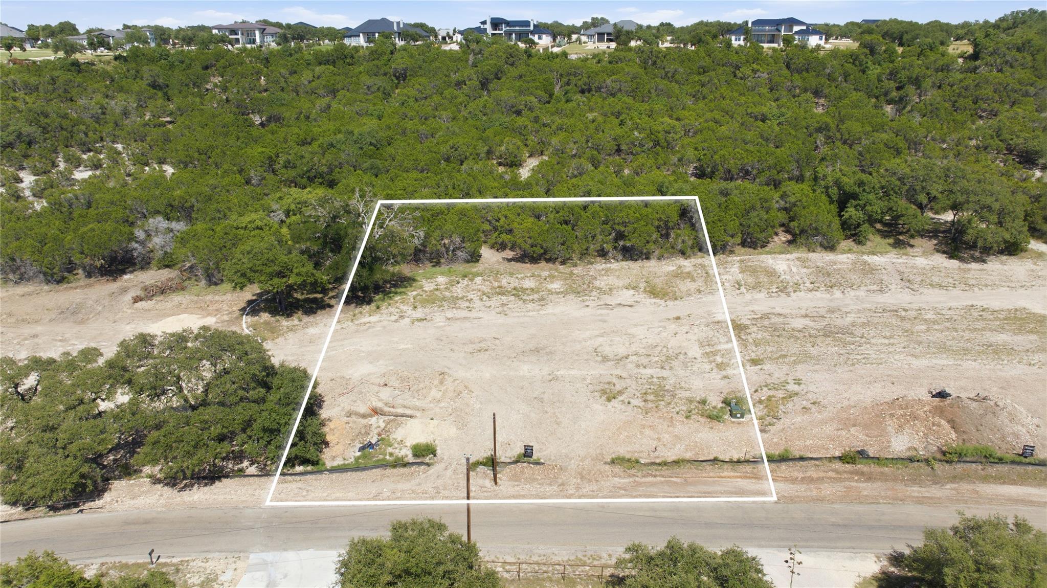 An aerial view captures the cleared building site