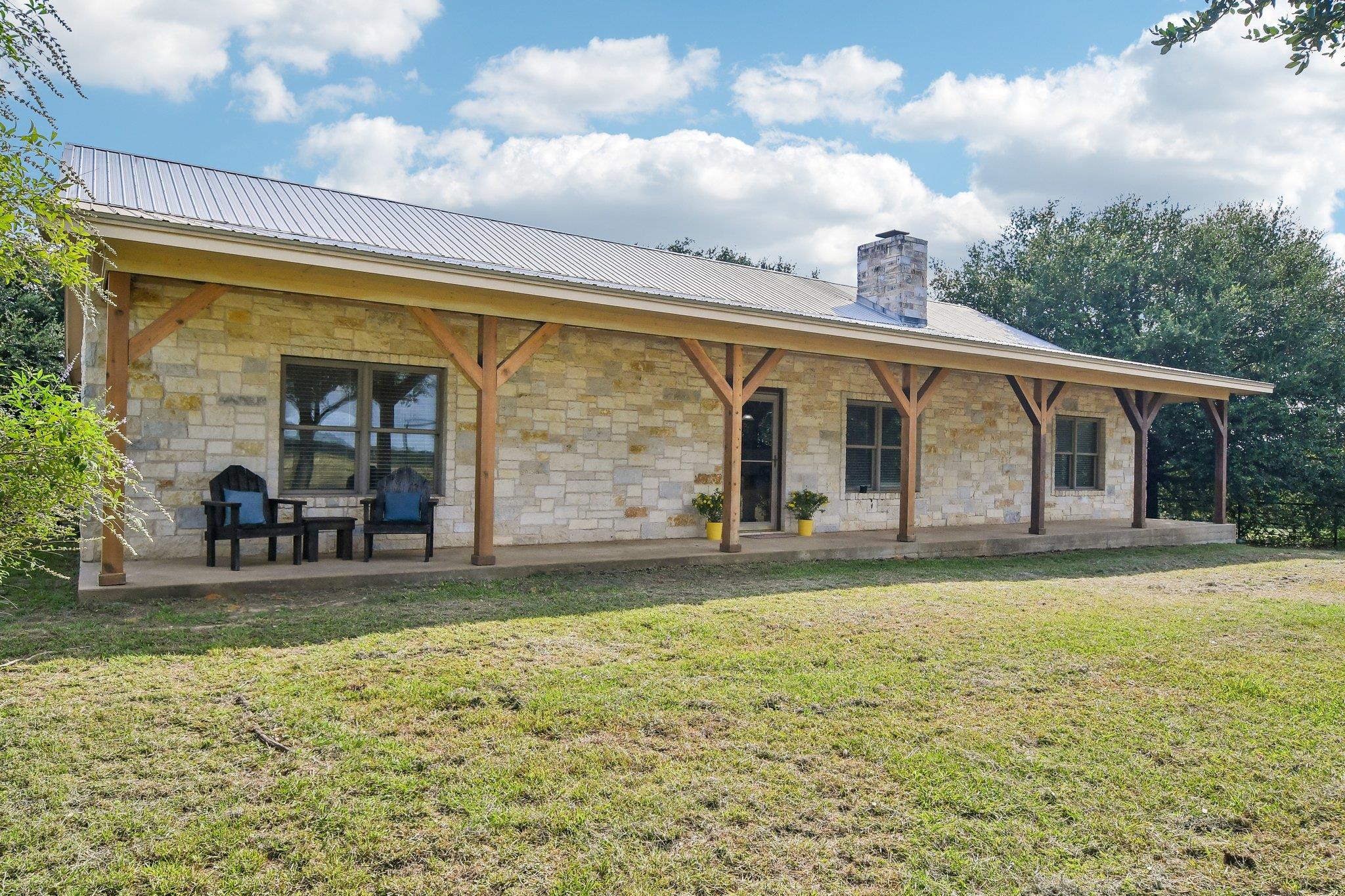 A welcoming front porch extends across this charm
