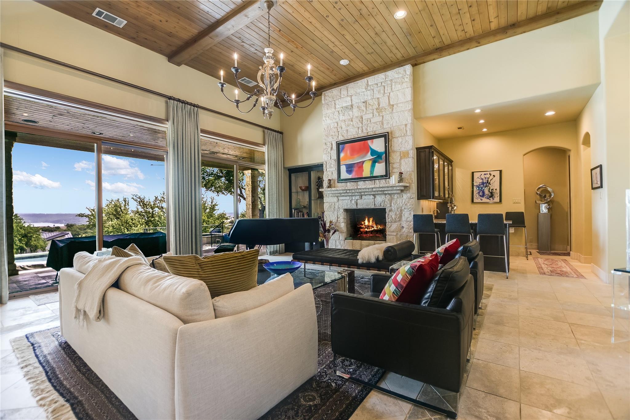 A spacious living area with soaring wood-beamed c