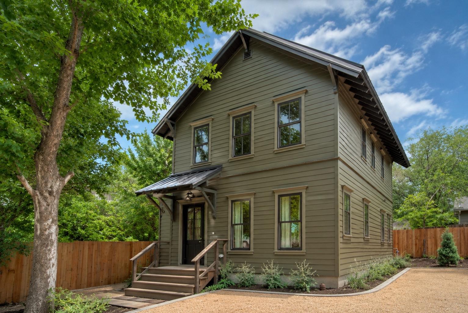 A striking modern farmhouse with vertical siding,