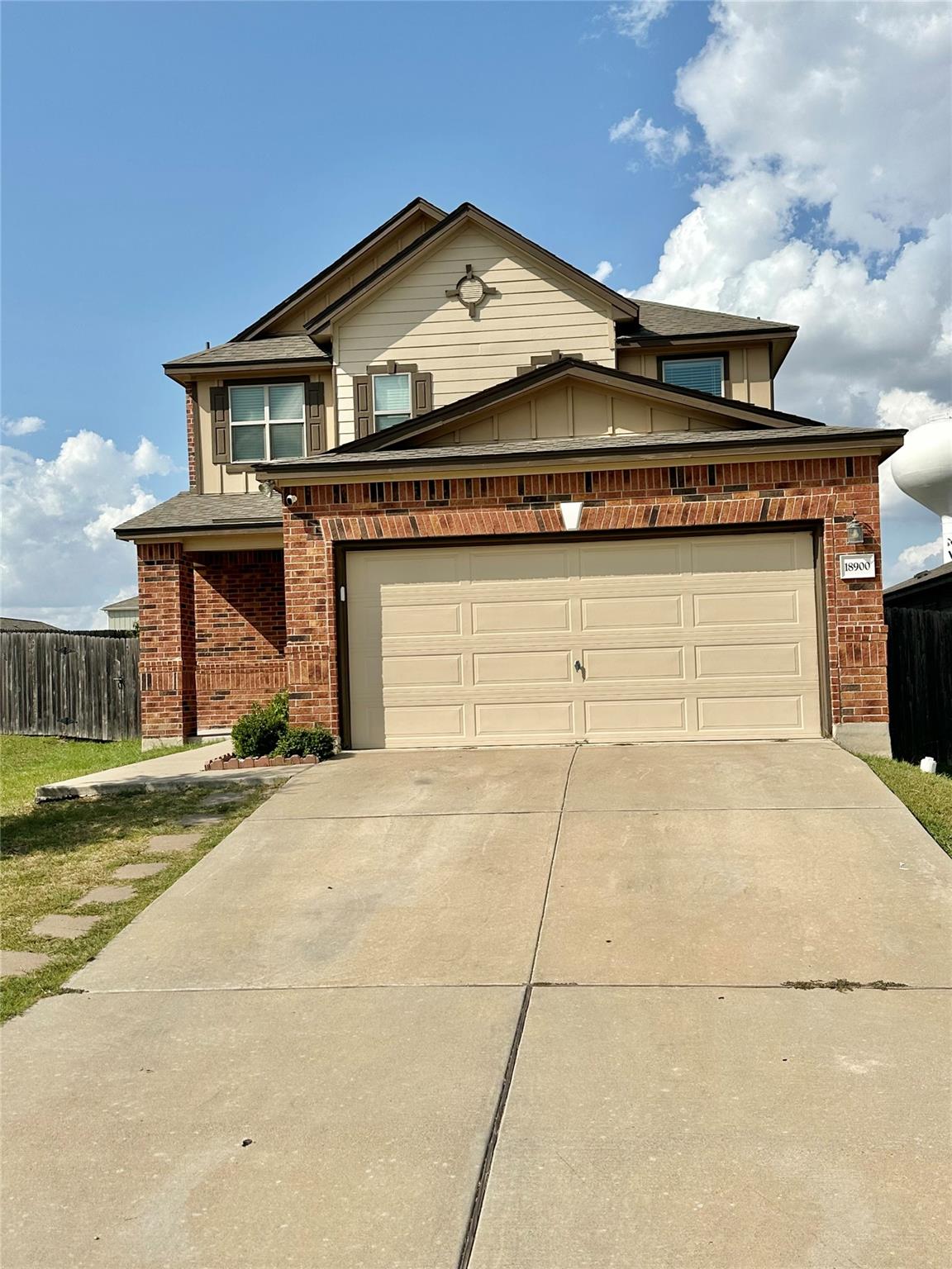 A classic brick facade with complementing siding 