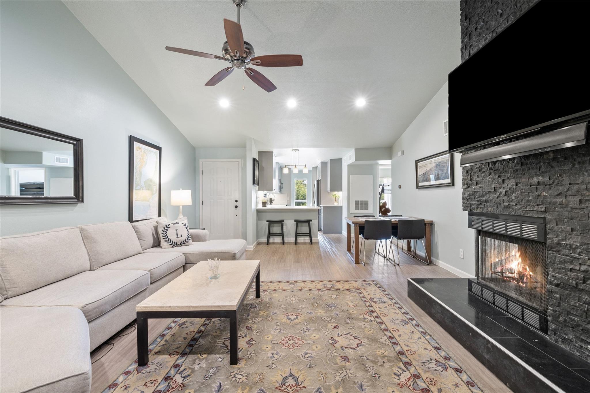 A welcoming living space with a cozy fireplace, s