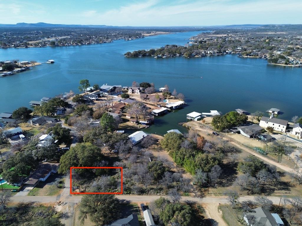 Secure this prime waterfront lot, a verdant canva
