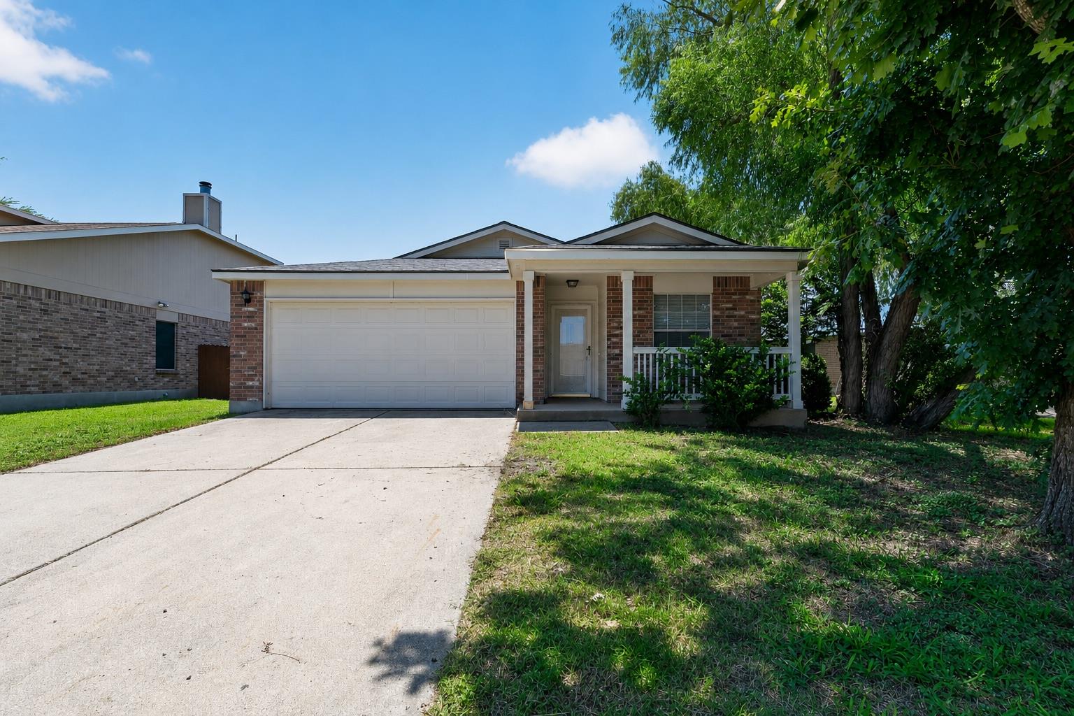 A welcoming brick facade with a covered porch and