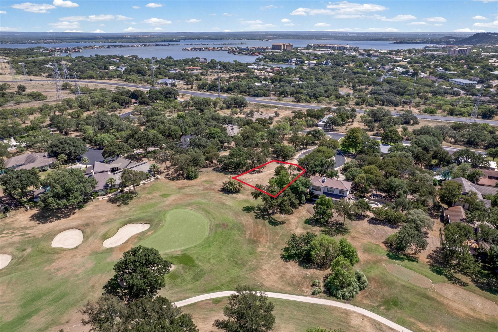 A prime golf course lot offers rolling green vist