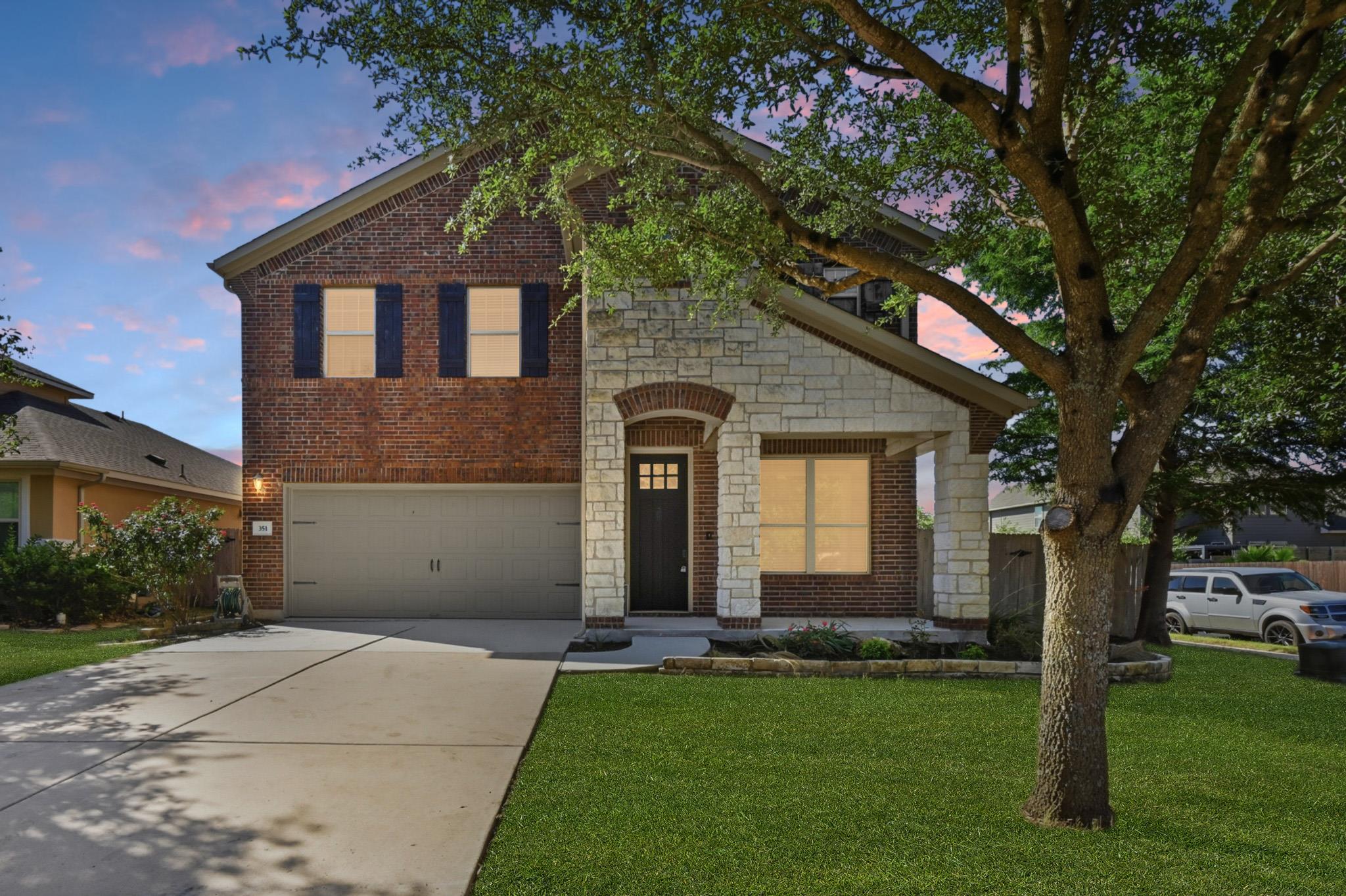 A classic brick facade with stone accents creates