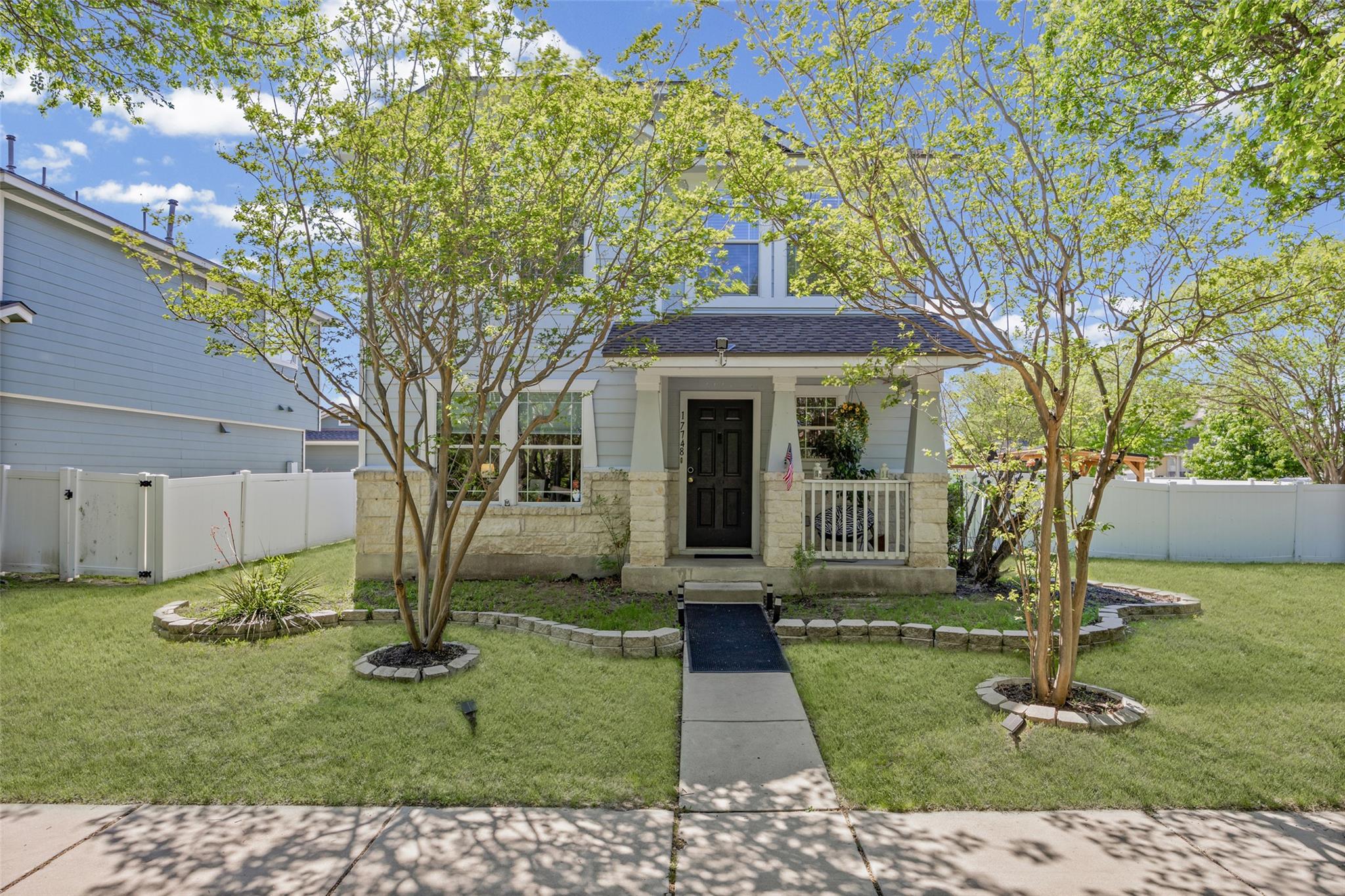A charming two-story home with a welcoming front 