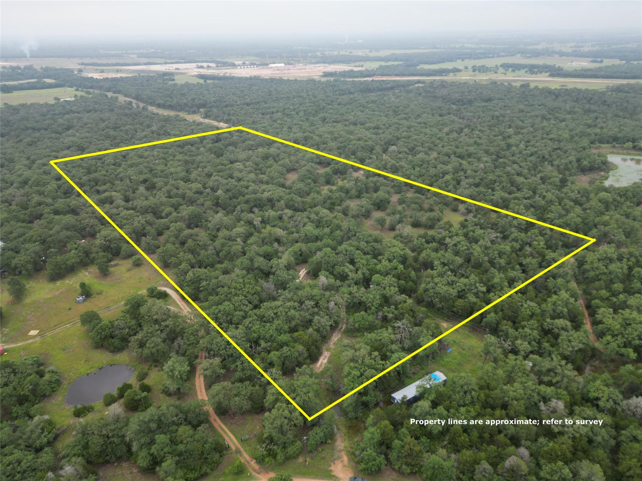 A tranquil, tree-filled acreage offers a private 