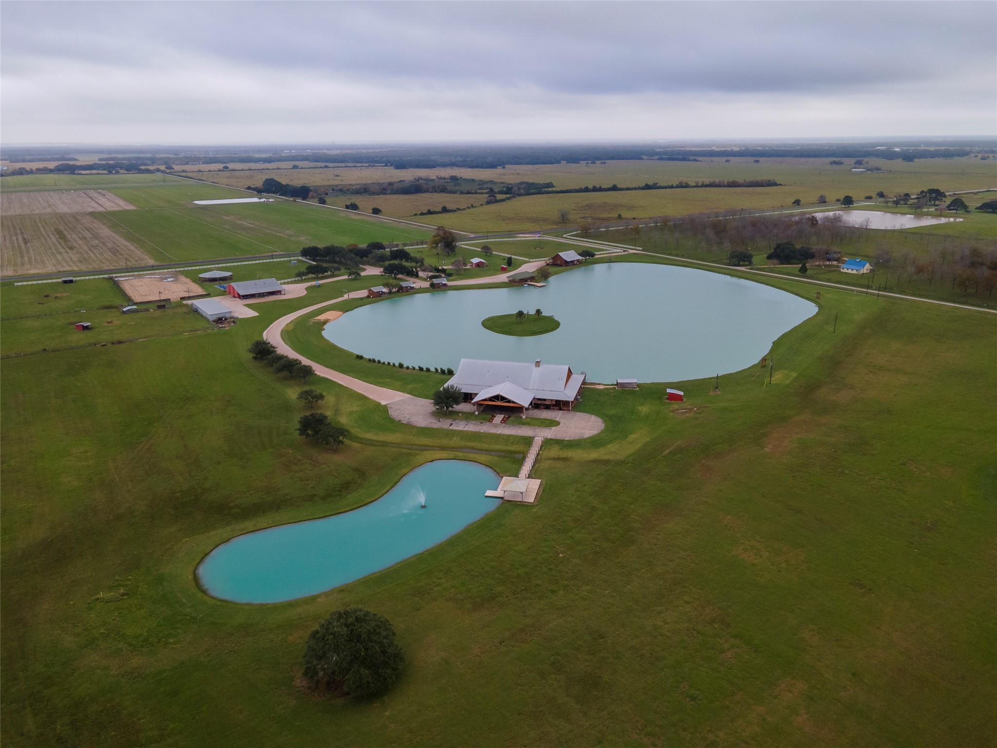 An aerial panorama reveals a vast estate with mul