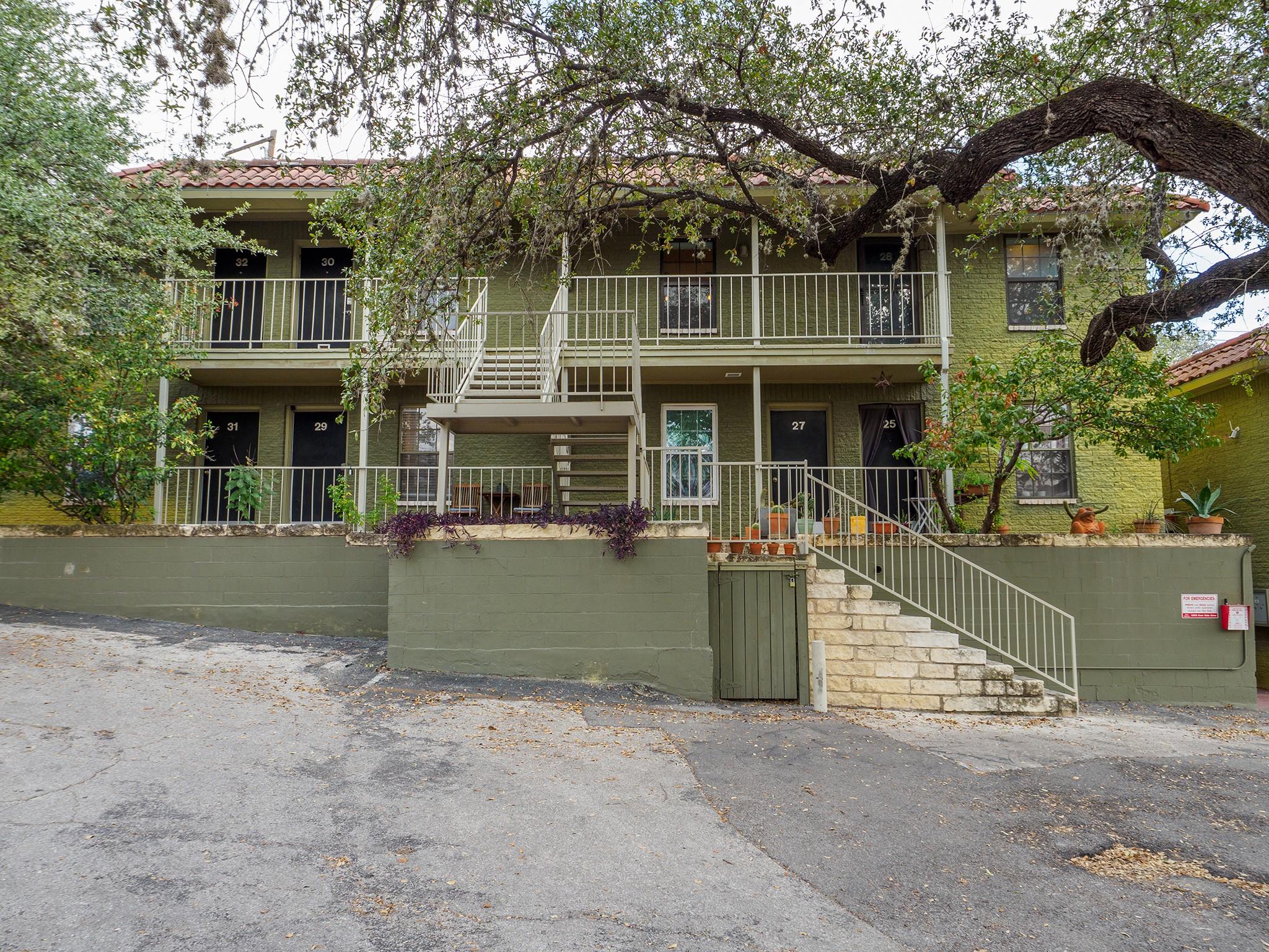 A charming two-story building features private ba