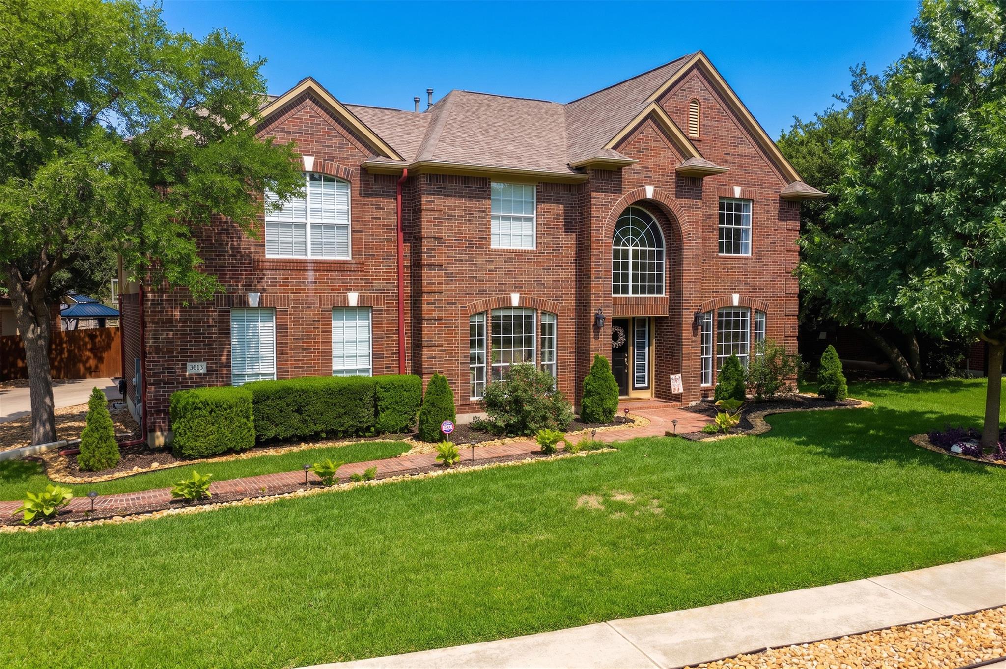 A classic brick exterior, complete with arching w