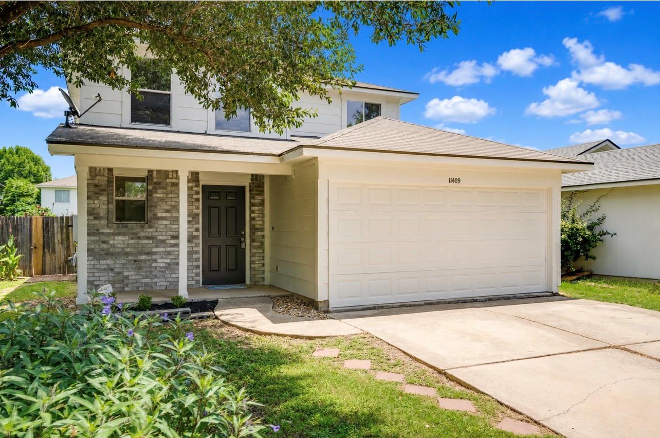 A classic facade welcomes with a covered entryway