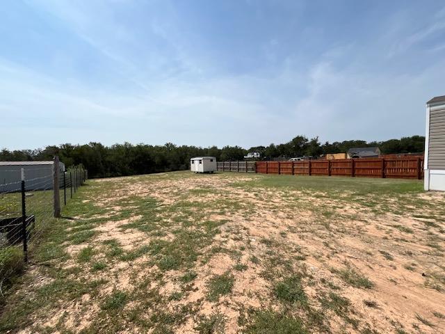 A spacious, uncultivated lot offers privacy with 
