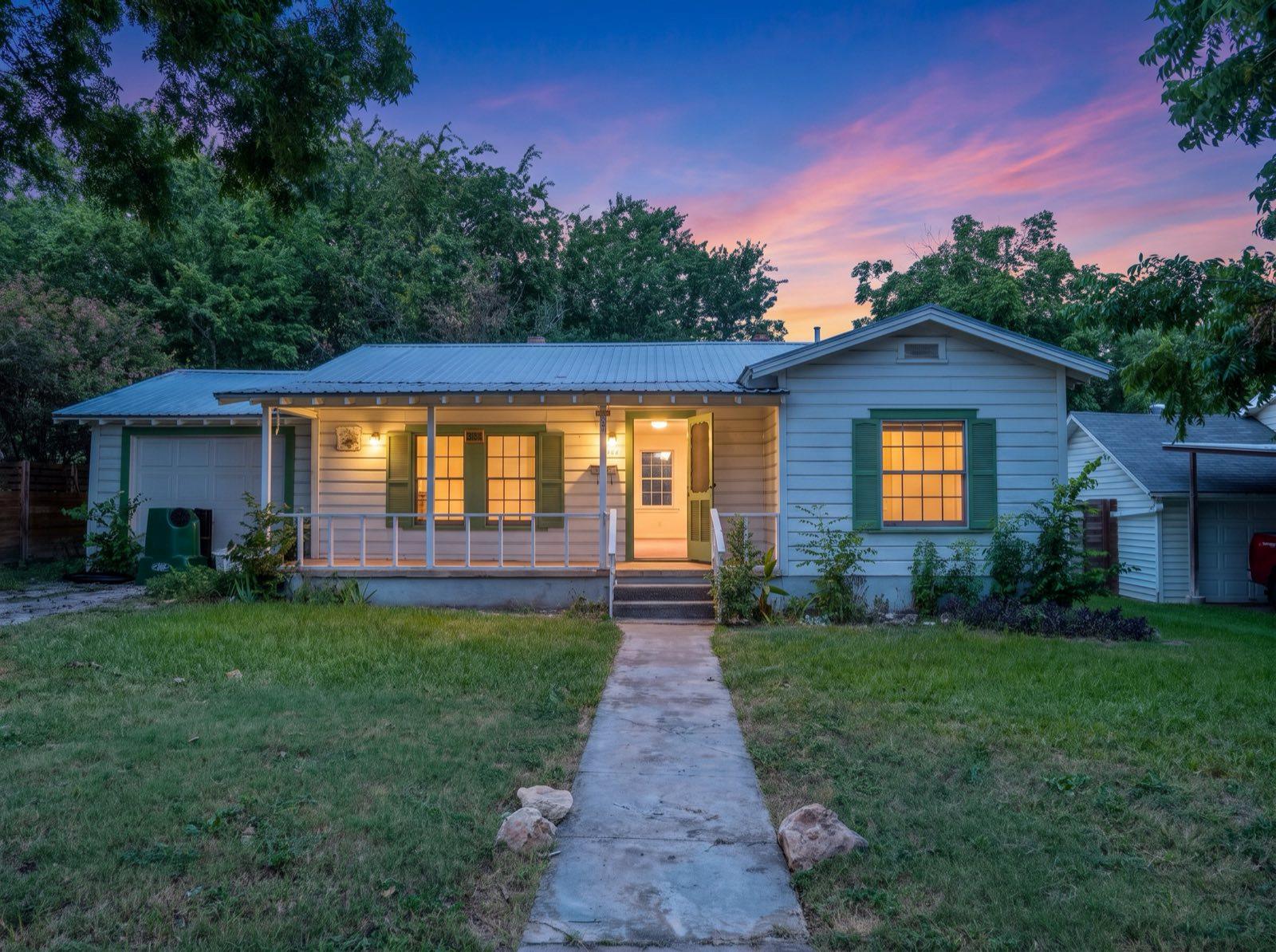 A charming bungalow with a welcoming front porch,