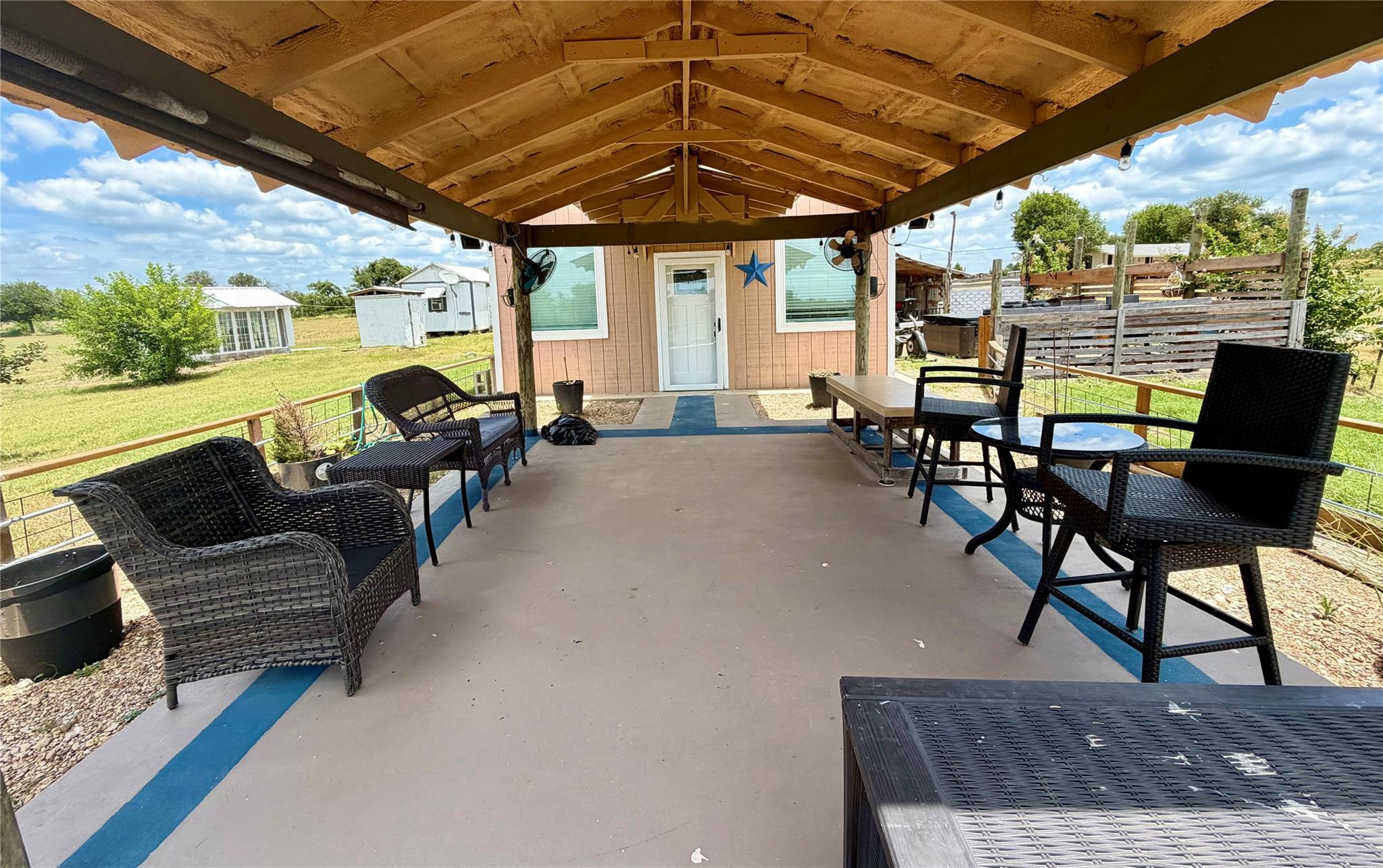 A spacious covered porch offers comfortable outdo