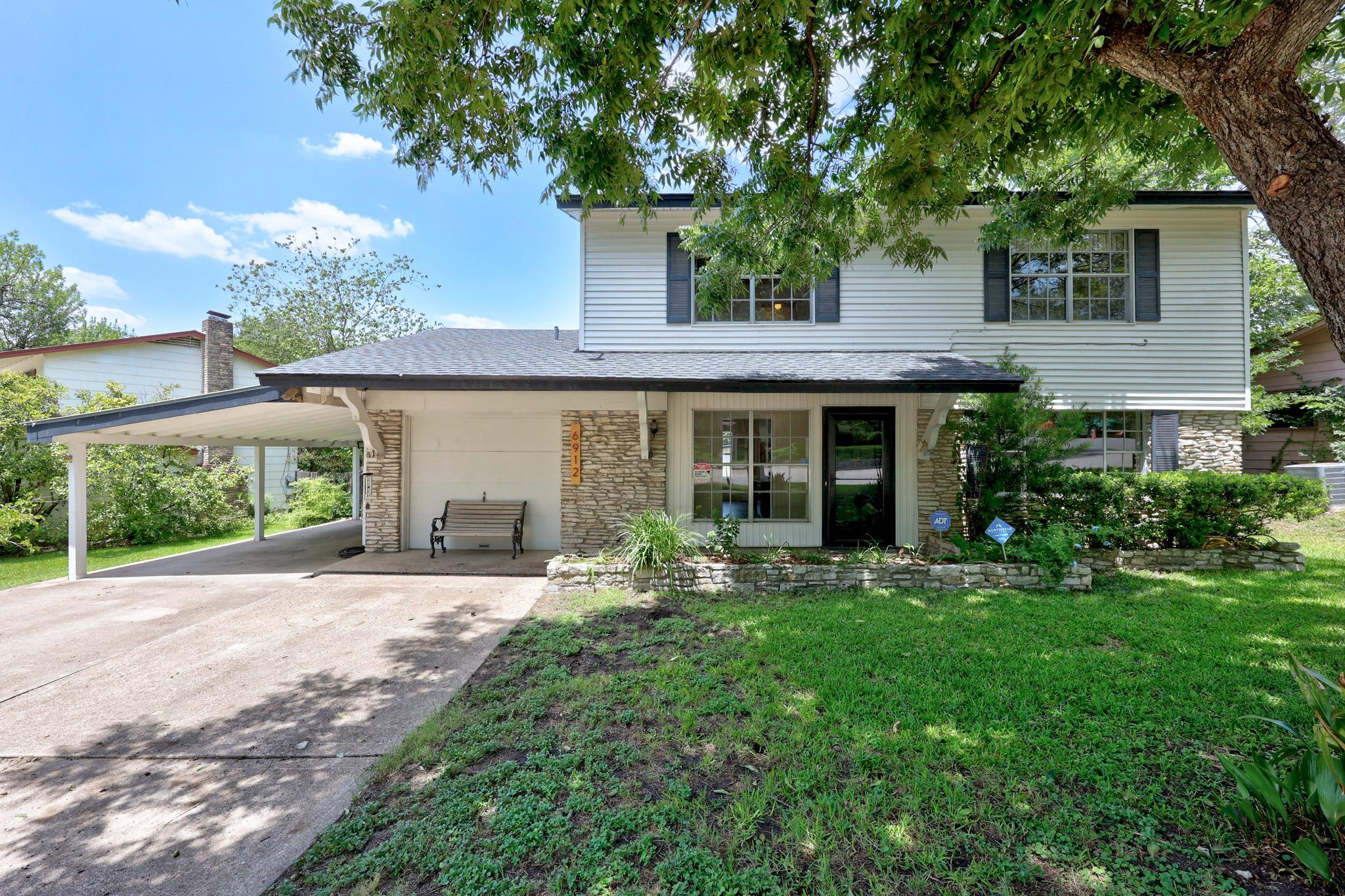 A charming exterior combines stone accents and tr