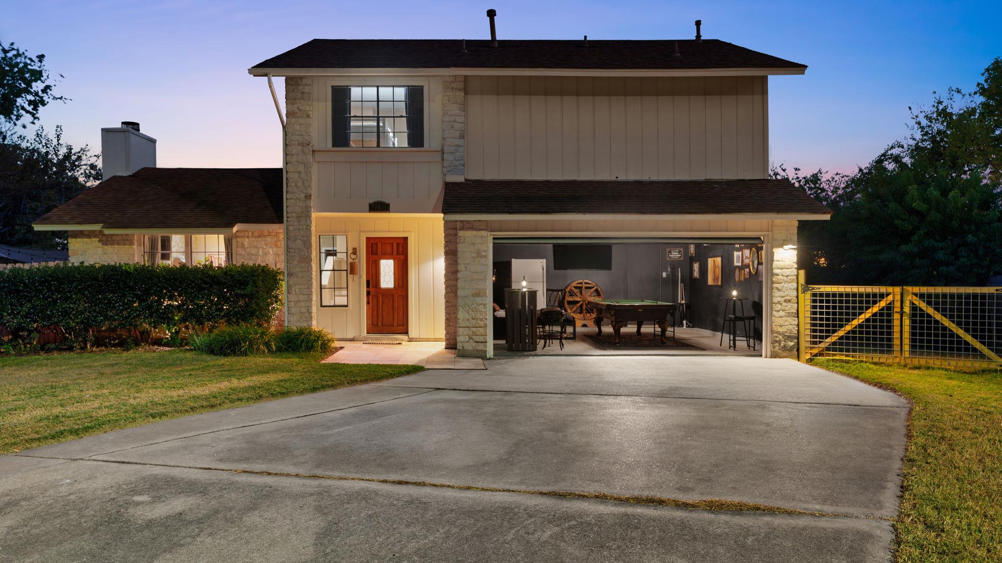 A welcoming entry and game room await in this cha