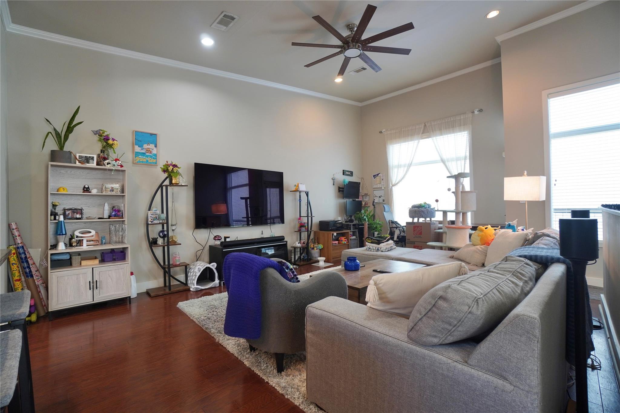 Rich hardwood floors complement high ceilings and