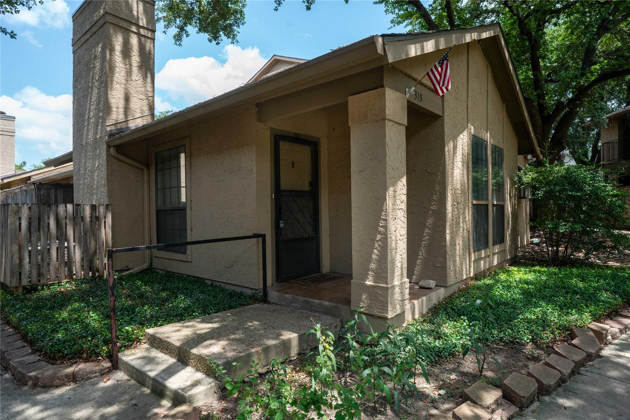 A welcoming entry, with a modest front porch and 