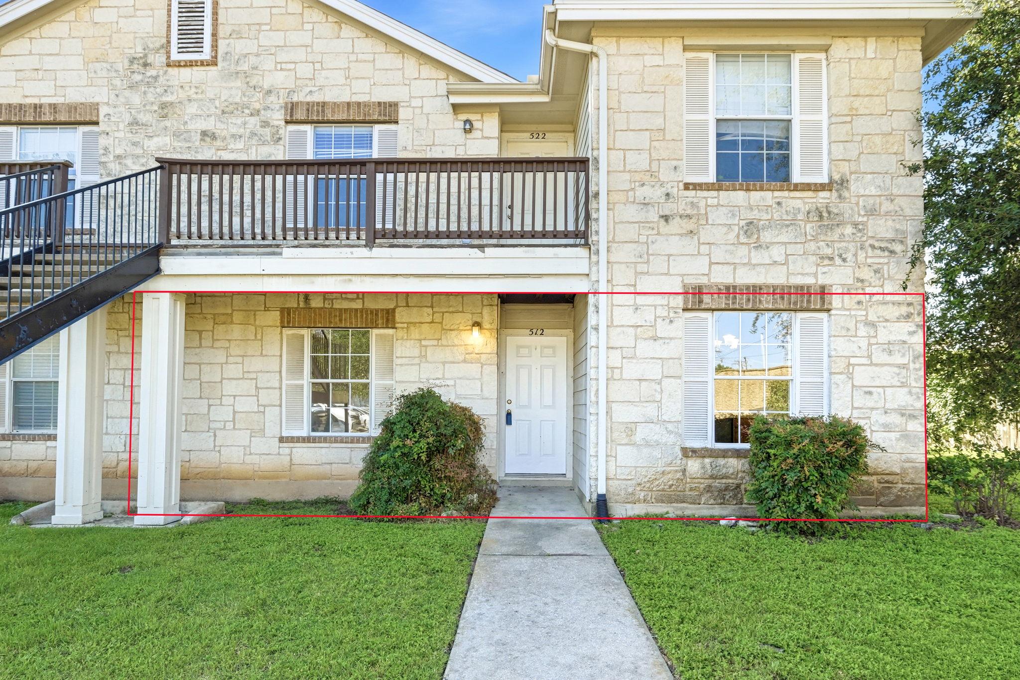 A classic stone facade with a welcoming front ent