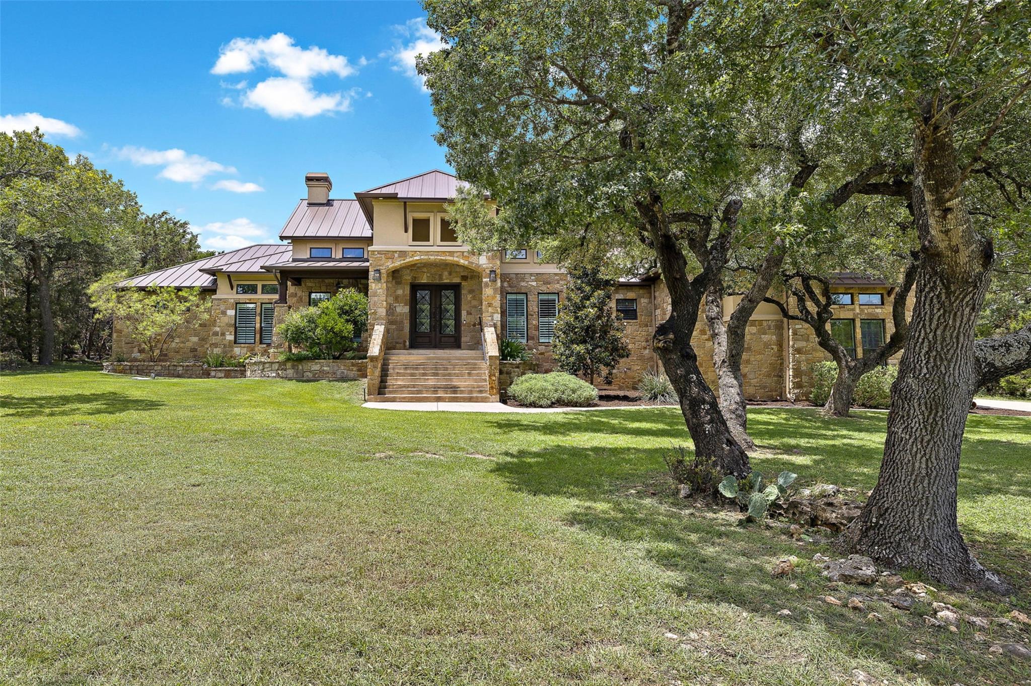 Elegant stone masonry and an inviting entry stair