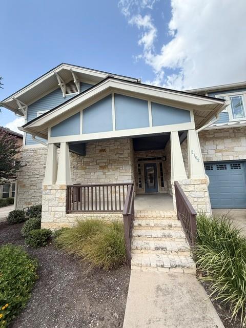 A welcoming front porch leads to the entrance of 