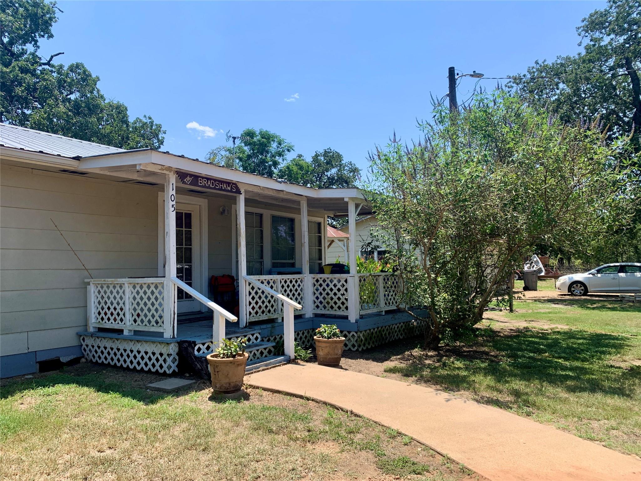 A welcoming front porch with lattice detailing be