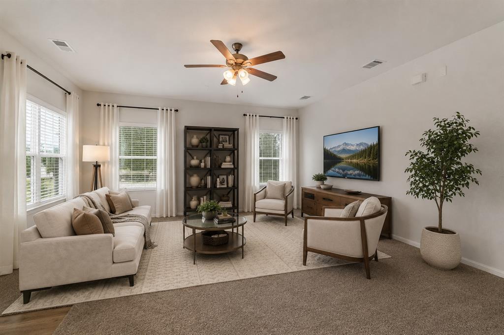 A comfortable living space featuring plush carpet