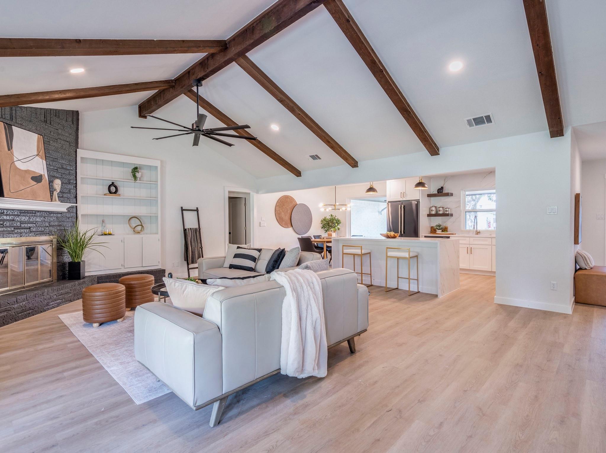 A vaulted ceiling with exposed beams highlights t