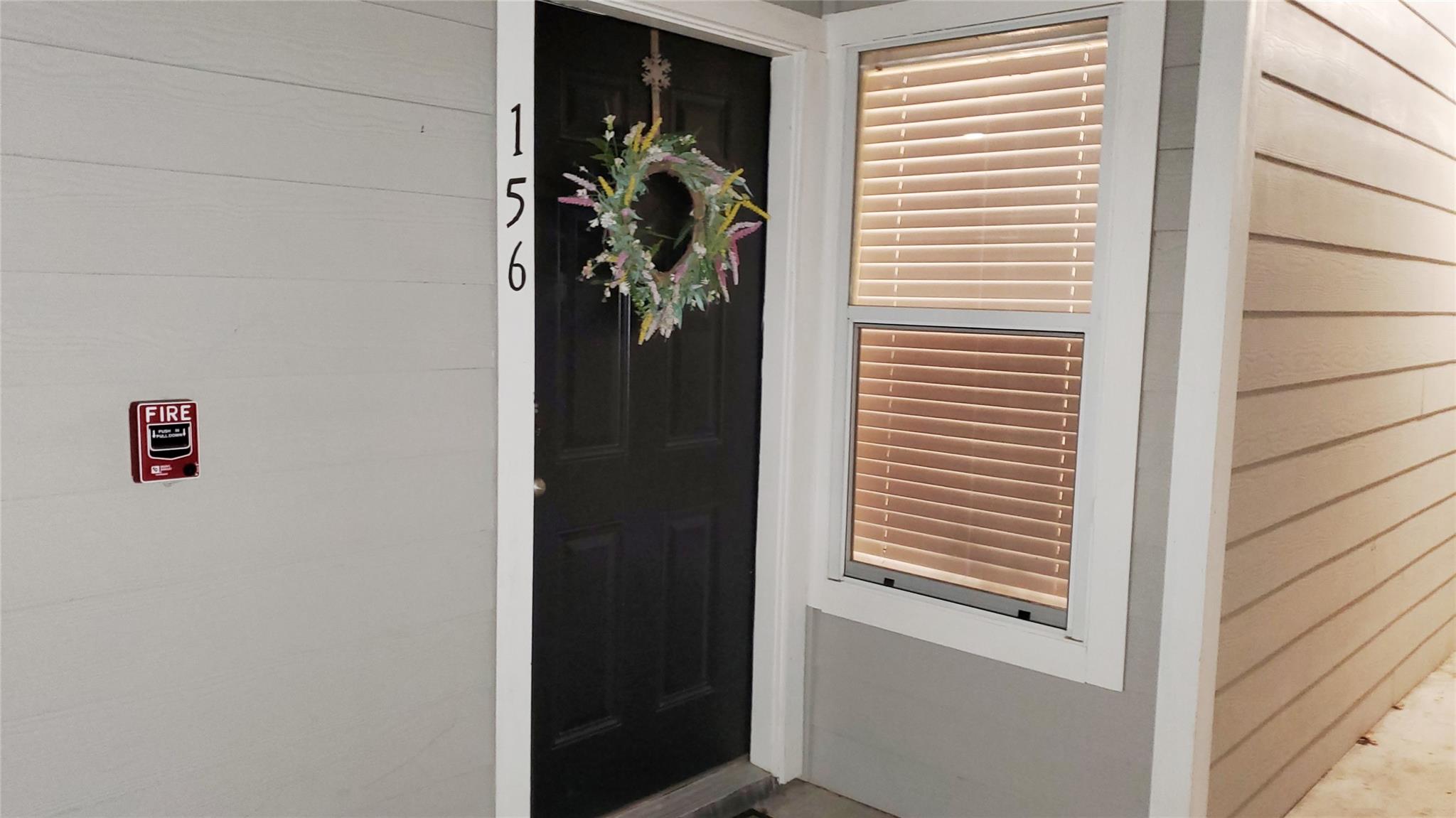 An inviting entry door provides access to a resid