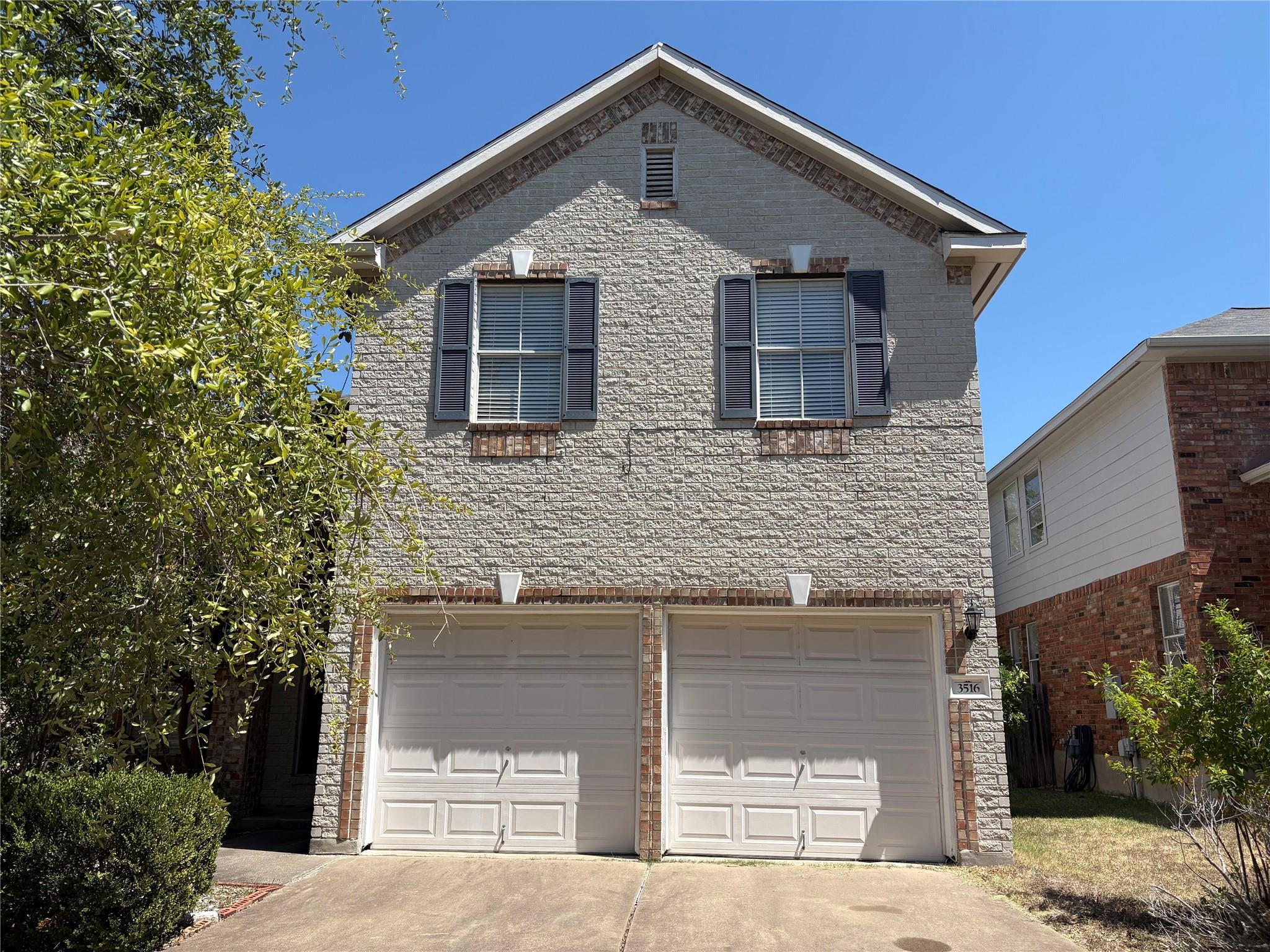 A classic brick exterior surrounds a prominent tw