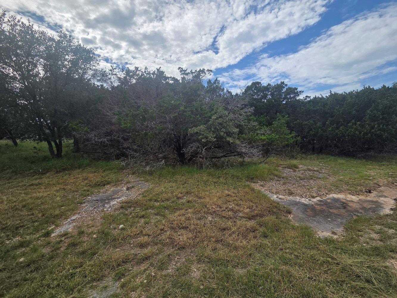 A verdant, well-treed lot offers a peaceful setti