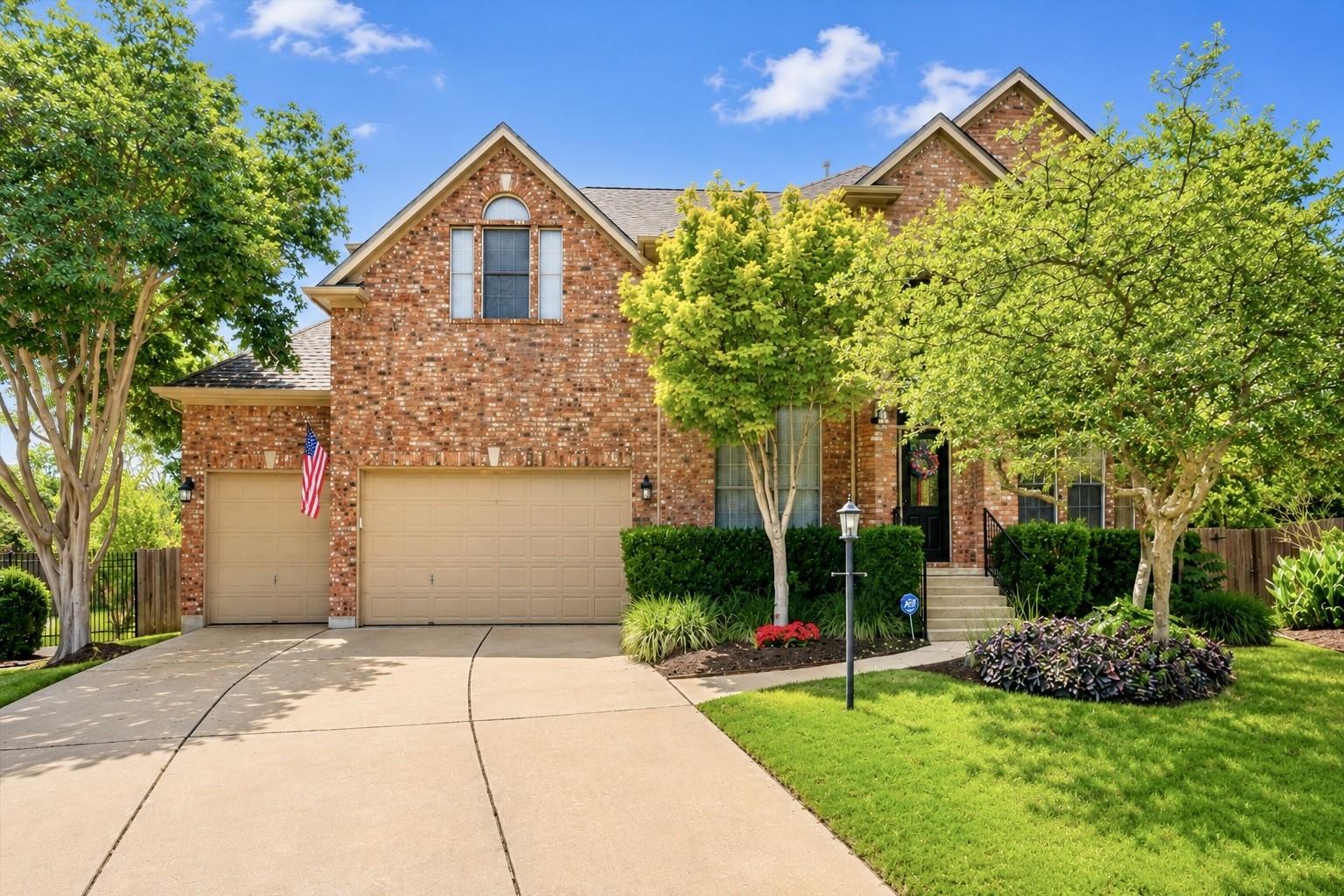 A classic brick exterior, well-manicured lawn, an
