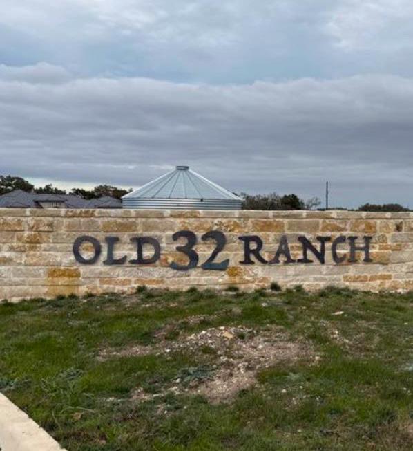 Stone masonry welcomes all to the Old 32 Ranch.