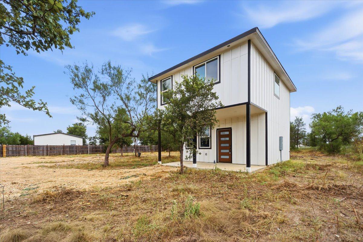 A modern two-story home with a clean facade stand