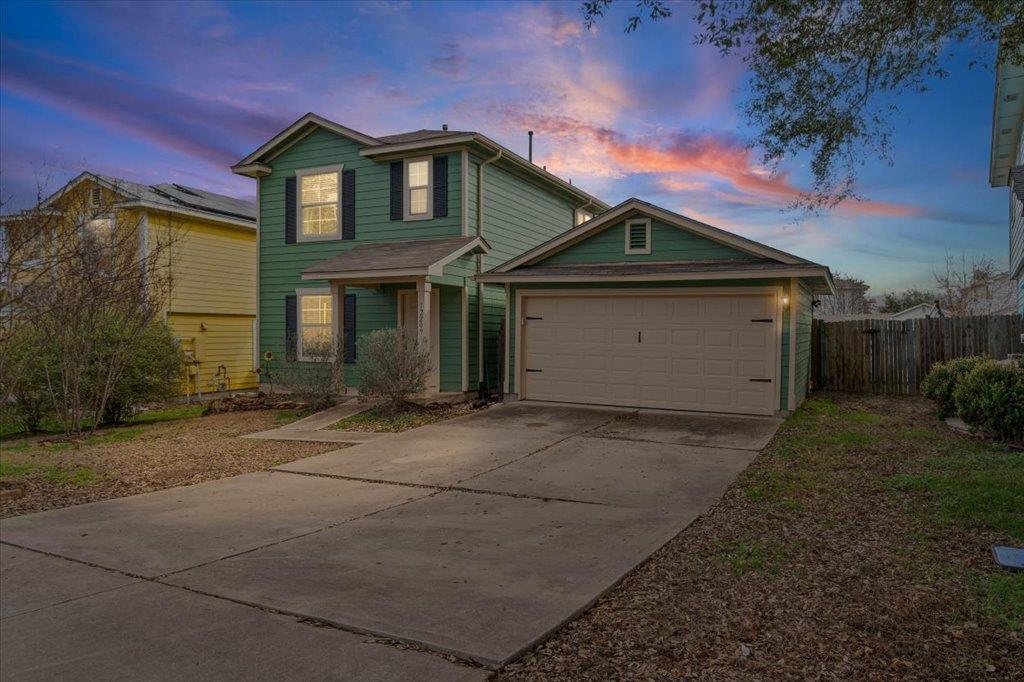 A well-maintained two-story residence with a conc