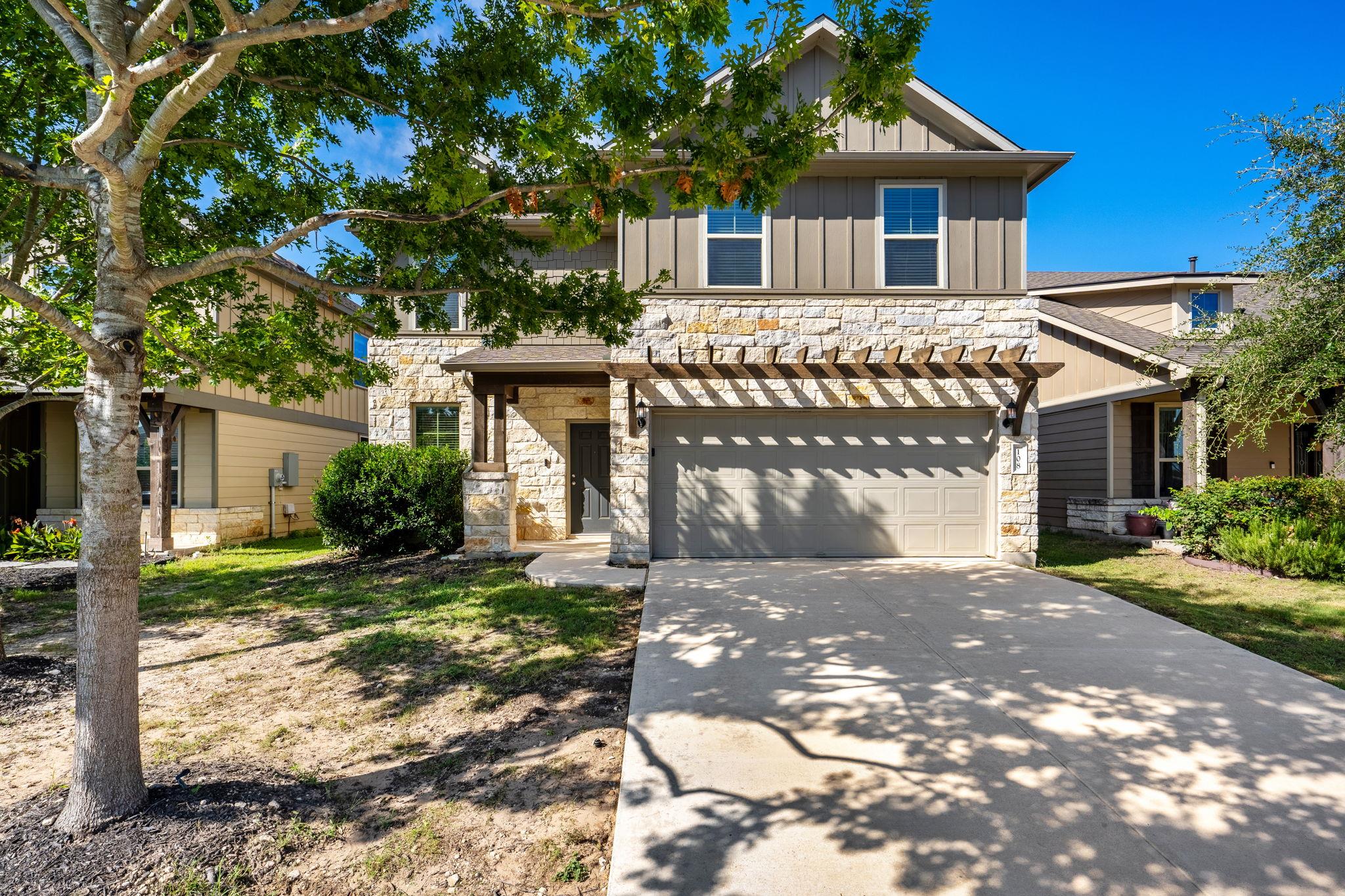 A stone and siding exterior offers inviting curb 