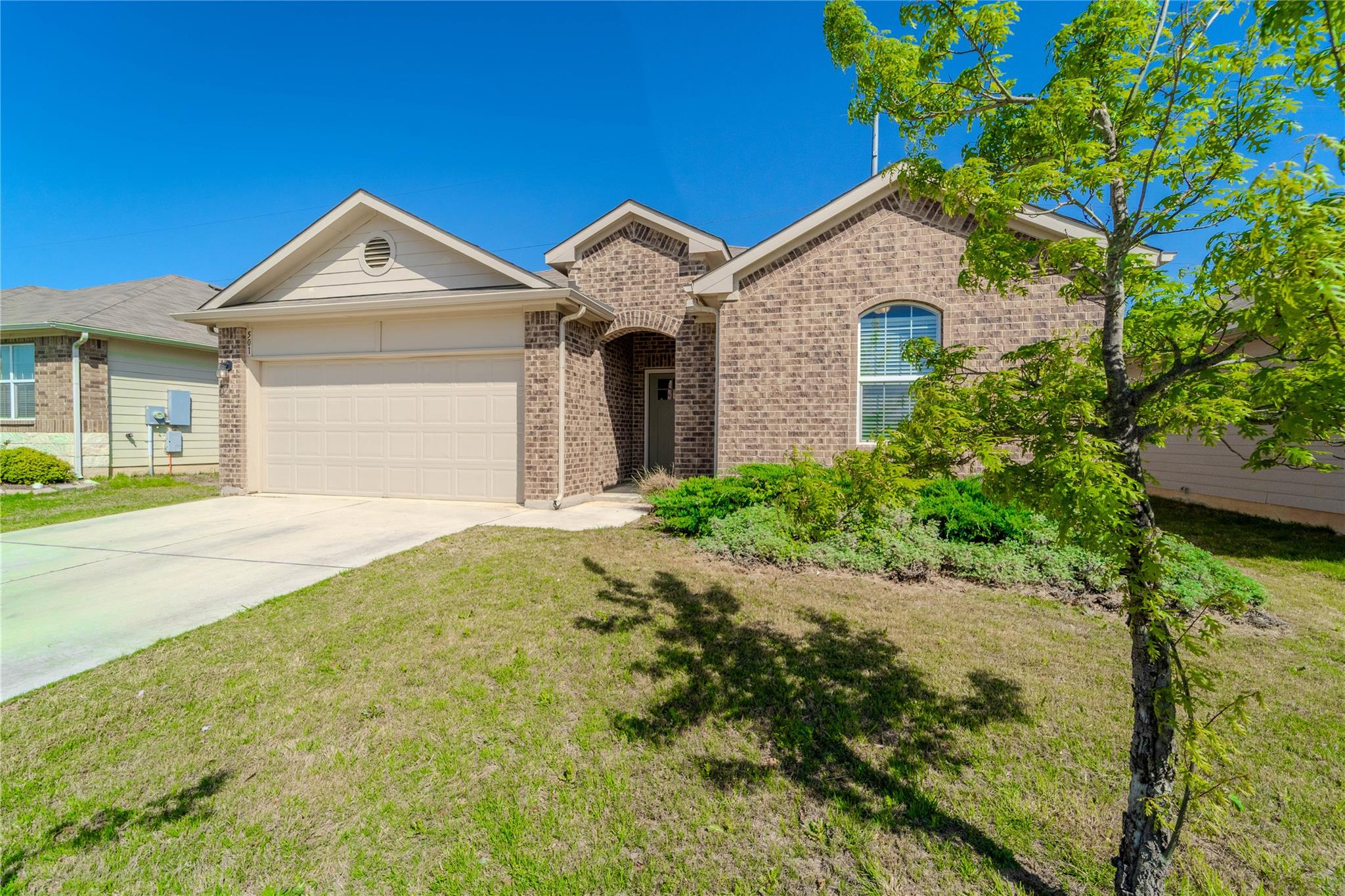 A classic brick exterior and well-maintained fron