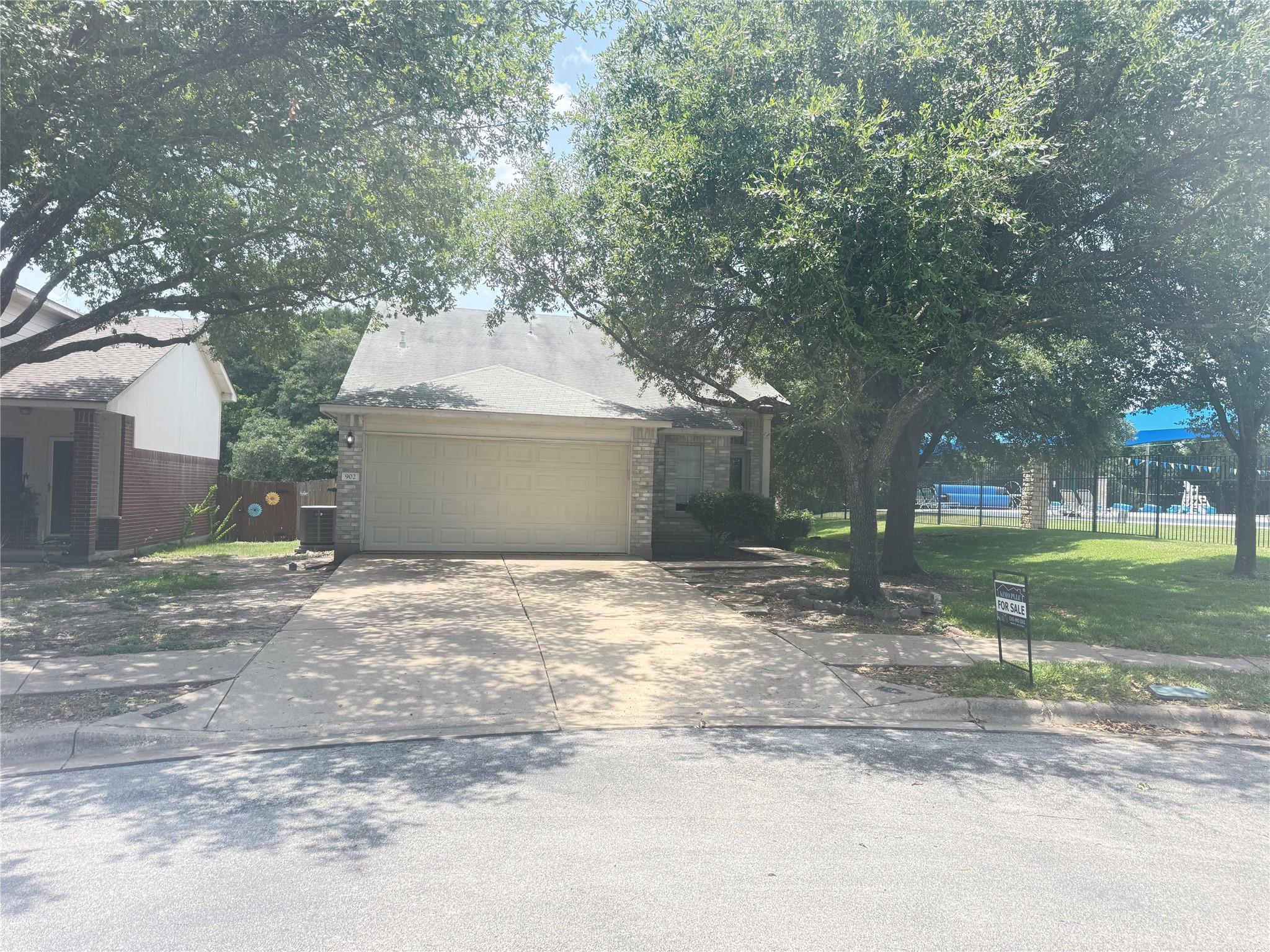 A welcoming driveway leads to a single-story home
